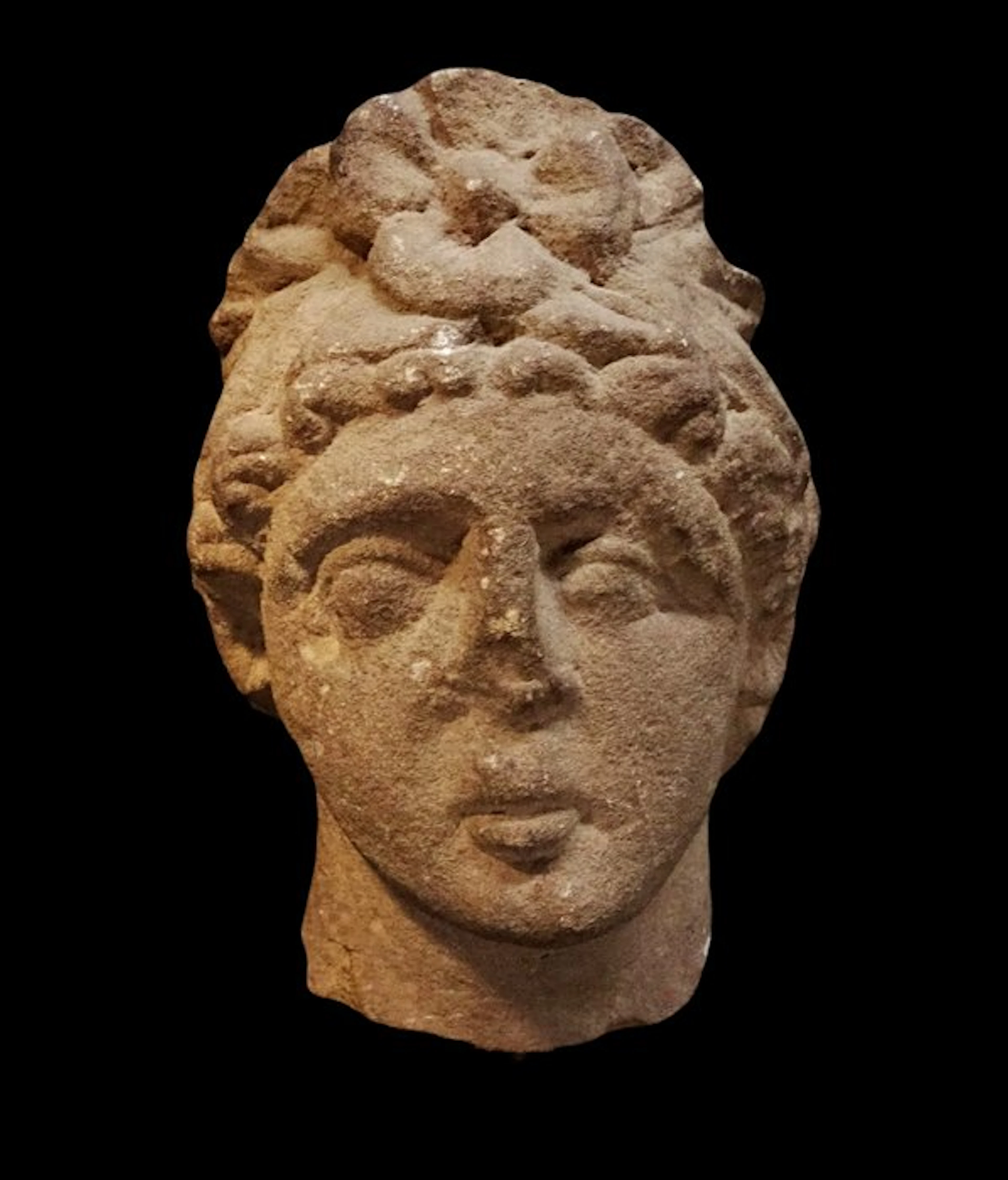 Ancient Roman Sculpted head of a young woman in sandstone...