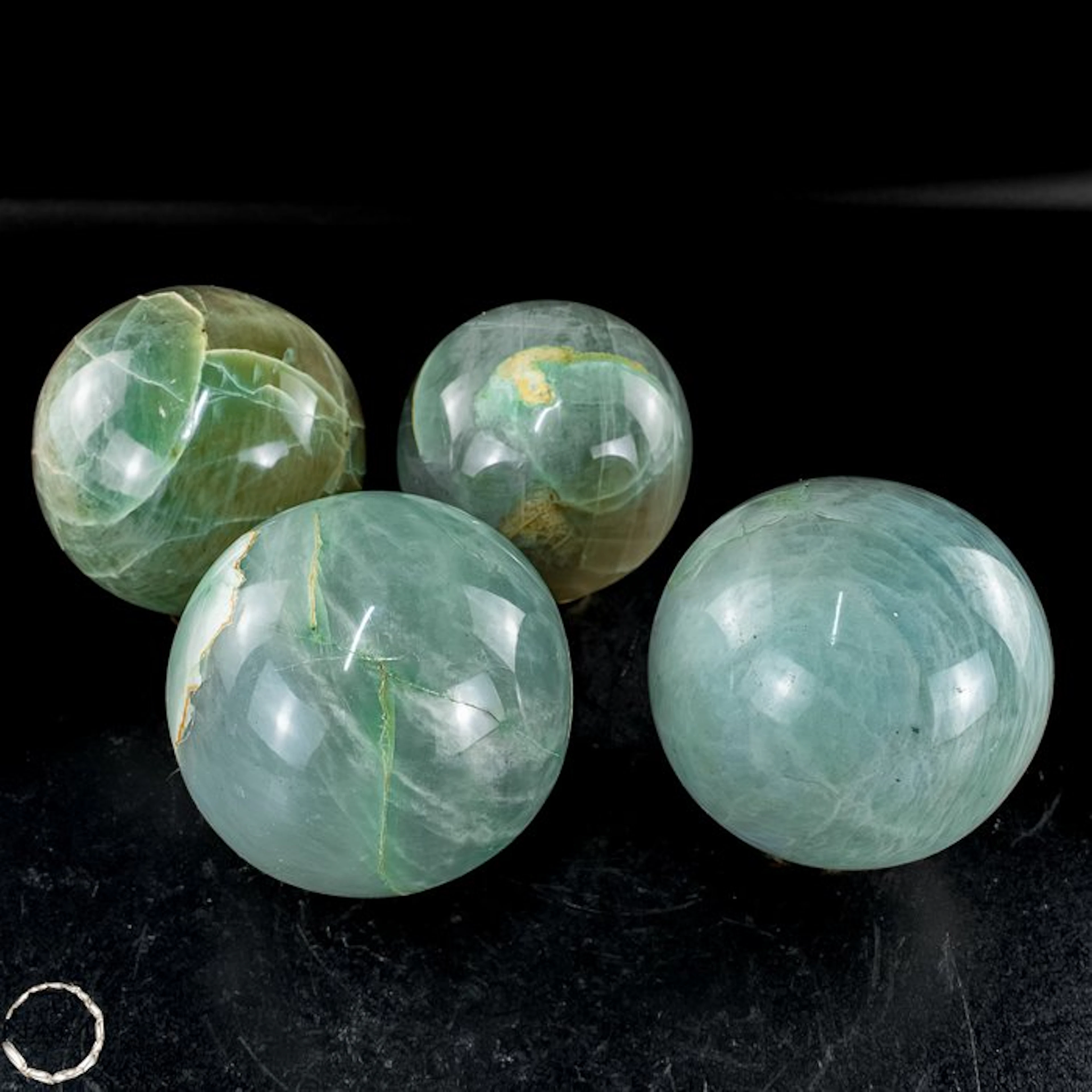 Exclusive garnierite moonstone sphere set – four large...