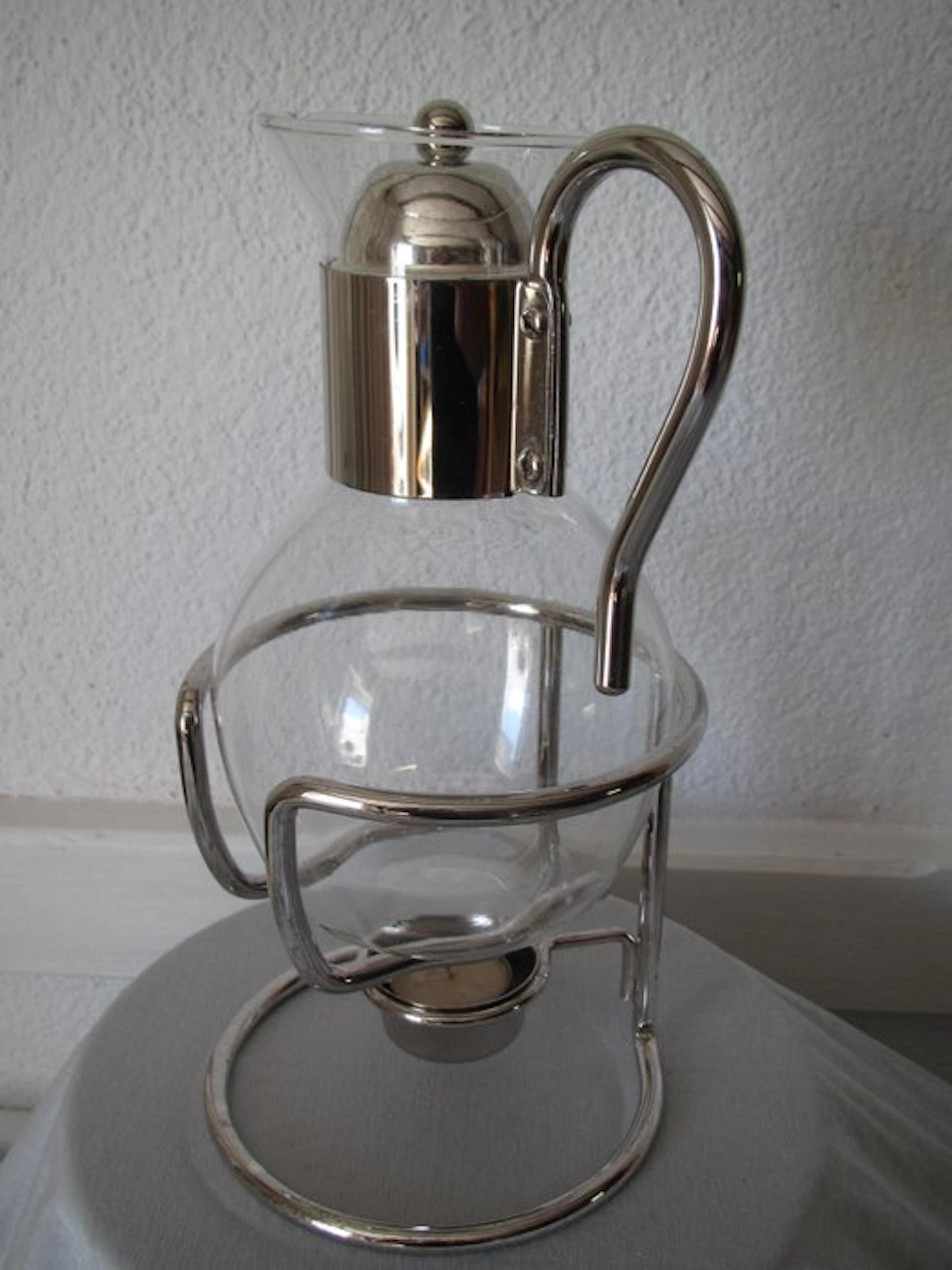 Can - a beautiful glass pitcher in a silver-plated frame
