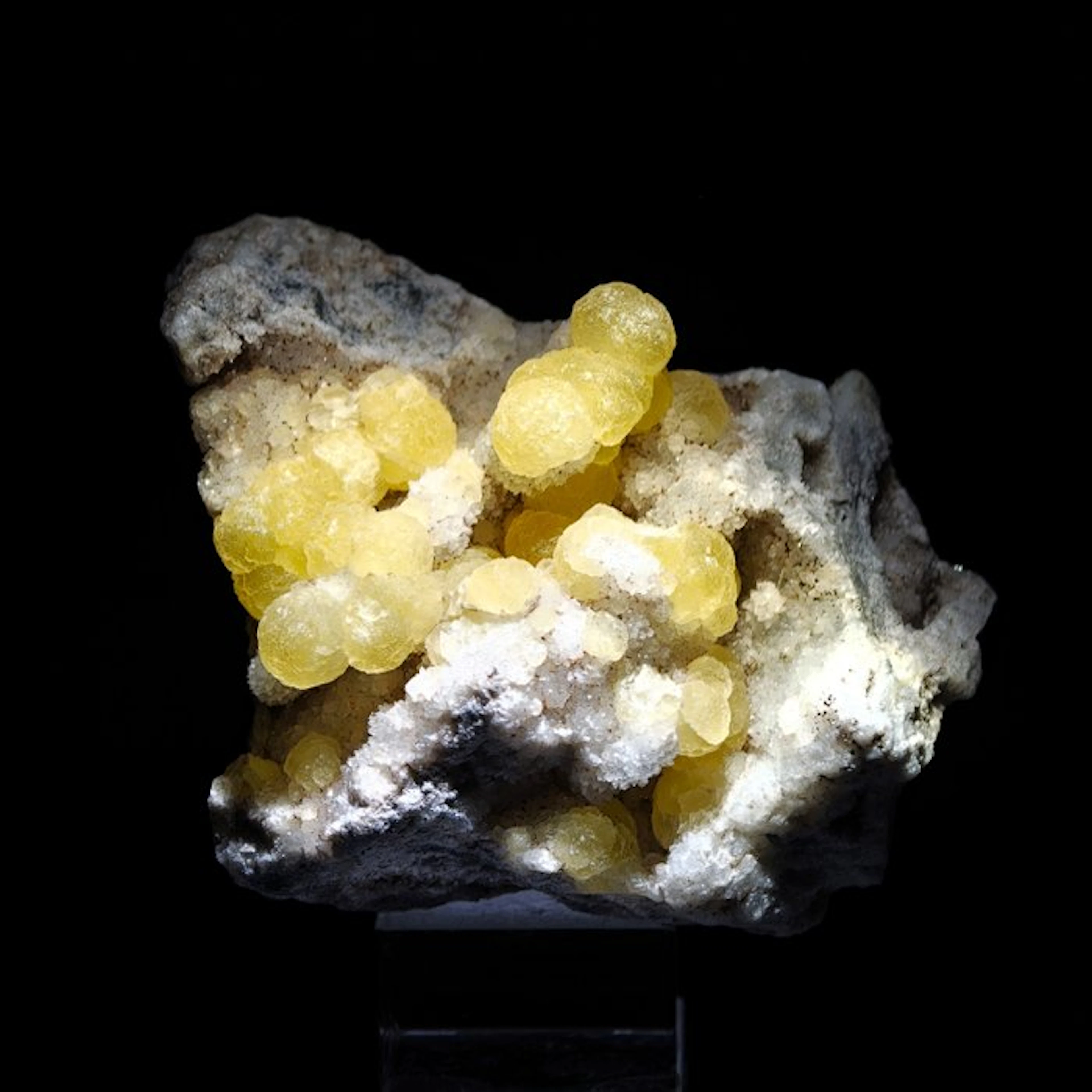 Yellow spherical fluorite on quartz