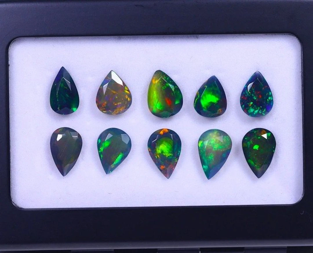 12.21 cts - 10 Faceted Natural Black Opal- 2.44 g
