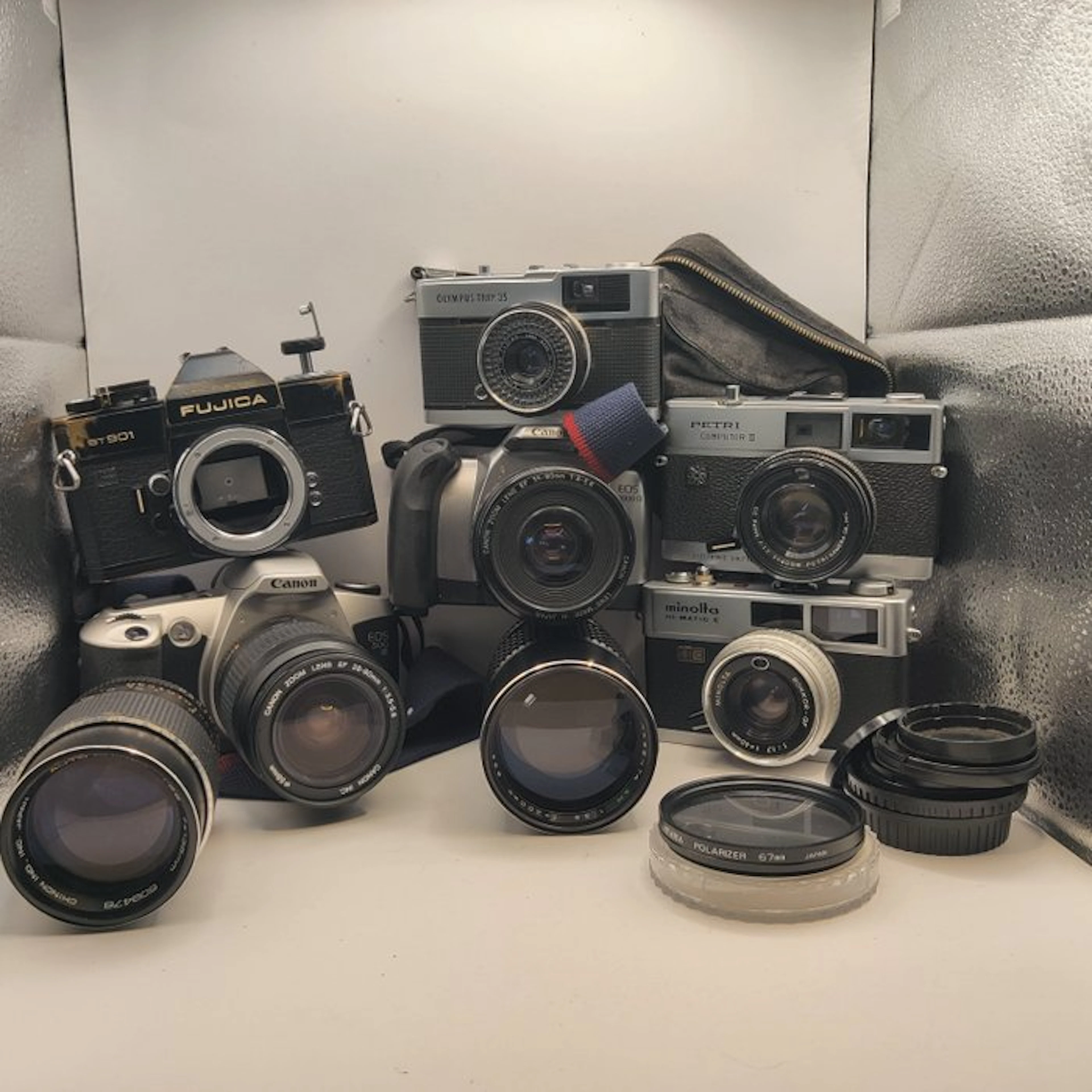Canon, Olympus