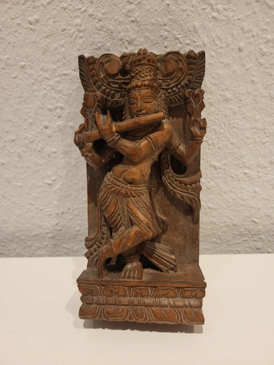 Hand-carved Indian relief of the god Krishna (Venugopala)...