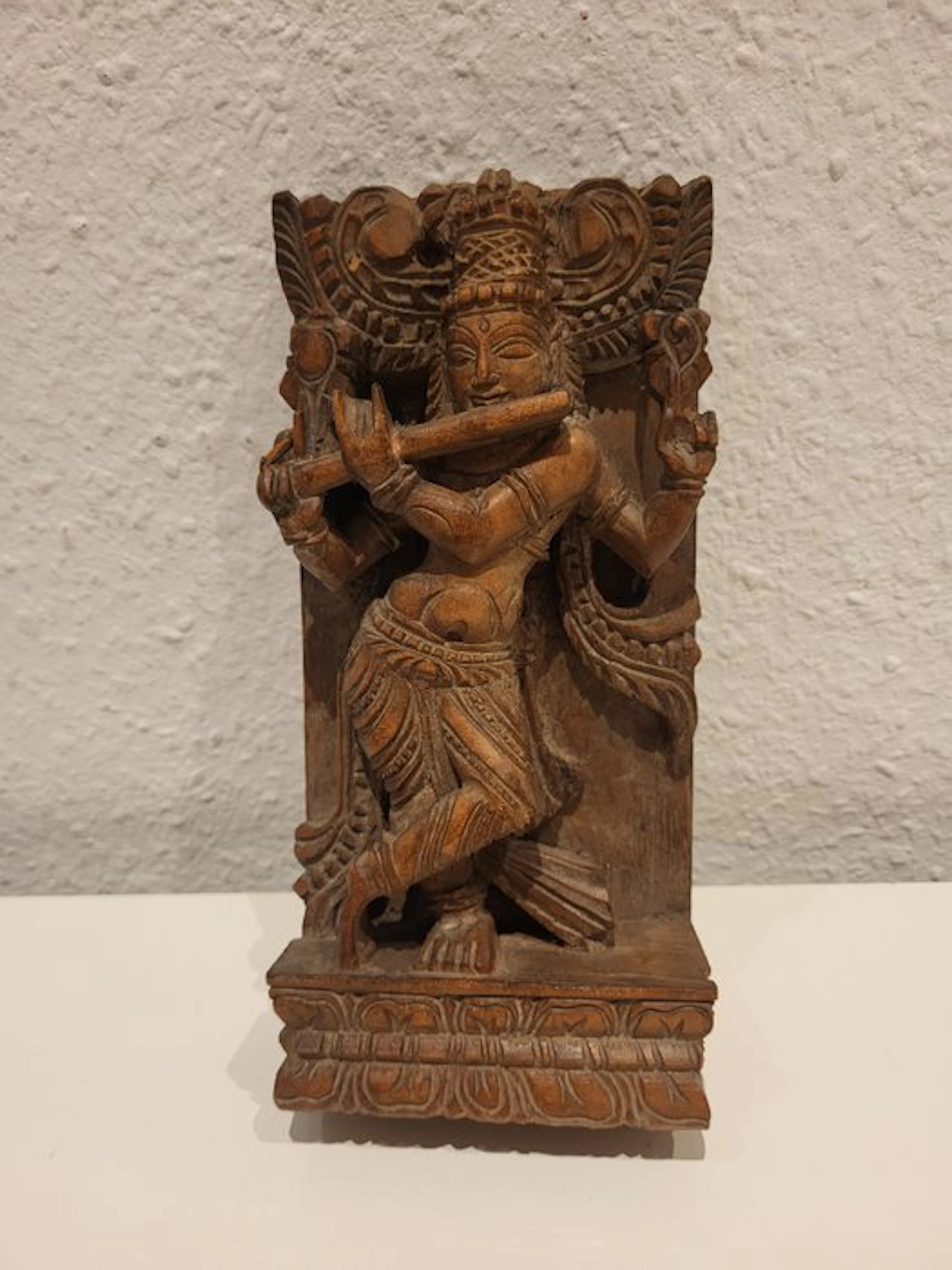 Hand-carved Indian relief of the god Krishna (Venugopala)...