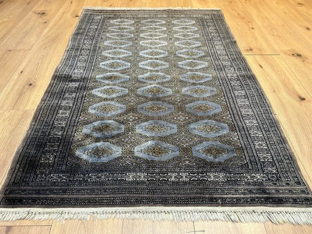 Stunning Bukhara rug in elegant gray-blue and bronze tones