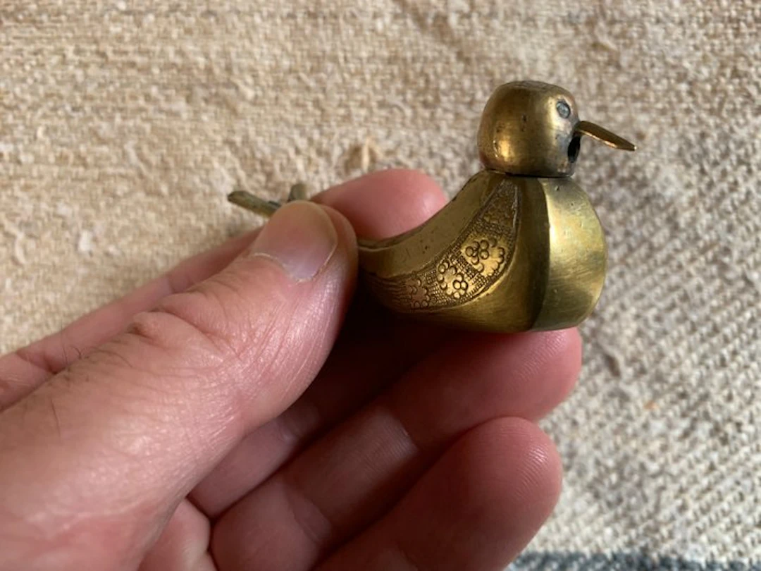 Tiny brass salt shaker shaped like a bird - Brass...