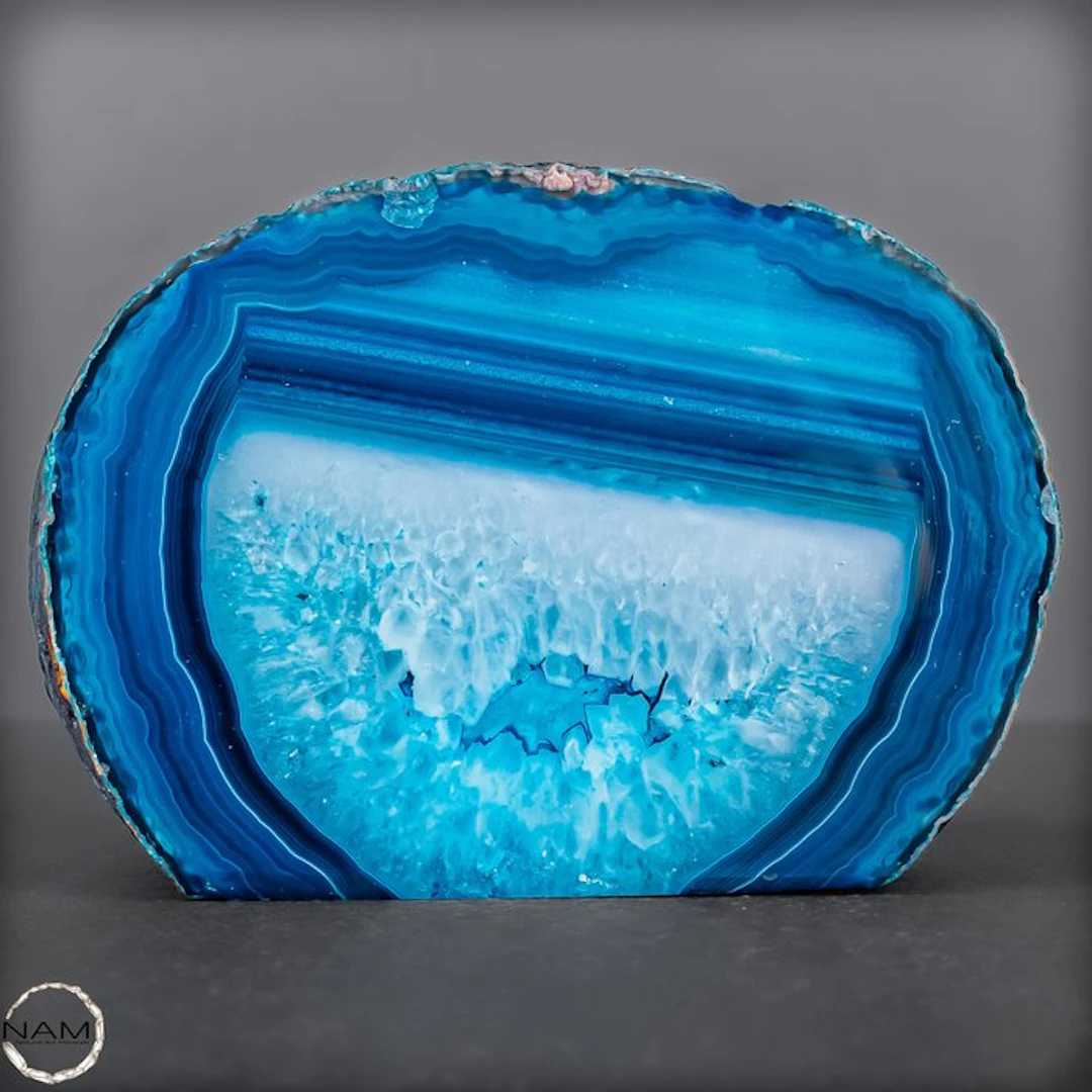 Fascinating agate slice in glowing blue. with striking banding- 601.02 g