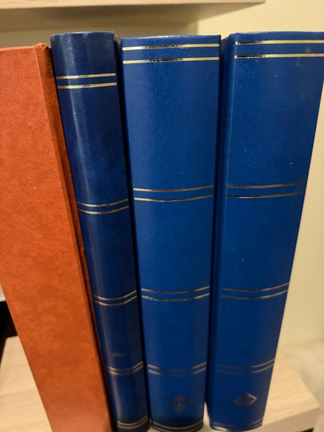 Belgium - Three thick and one thinner insert books with black pages.