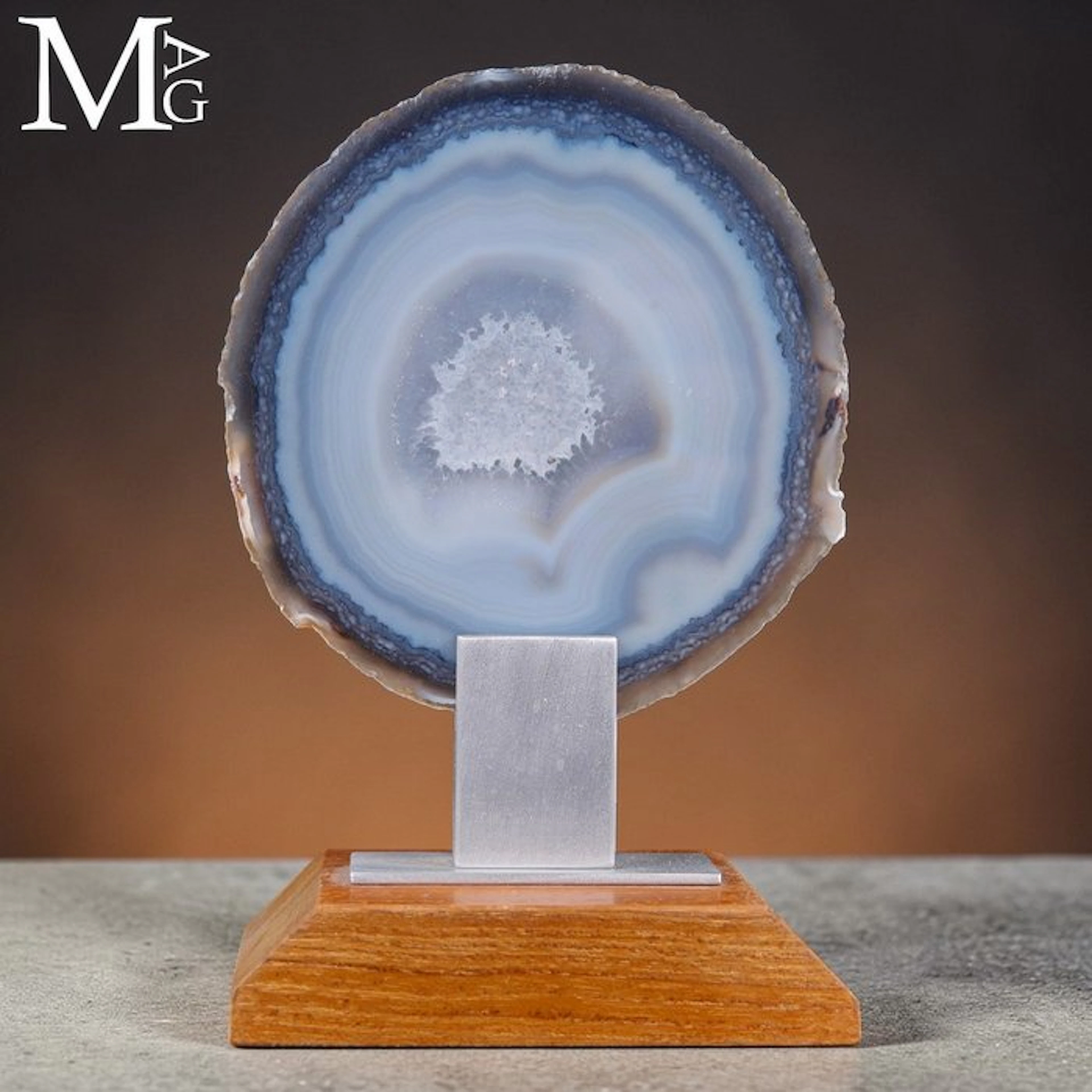 Polished geode slice with a sparkling central druzy...