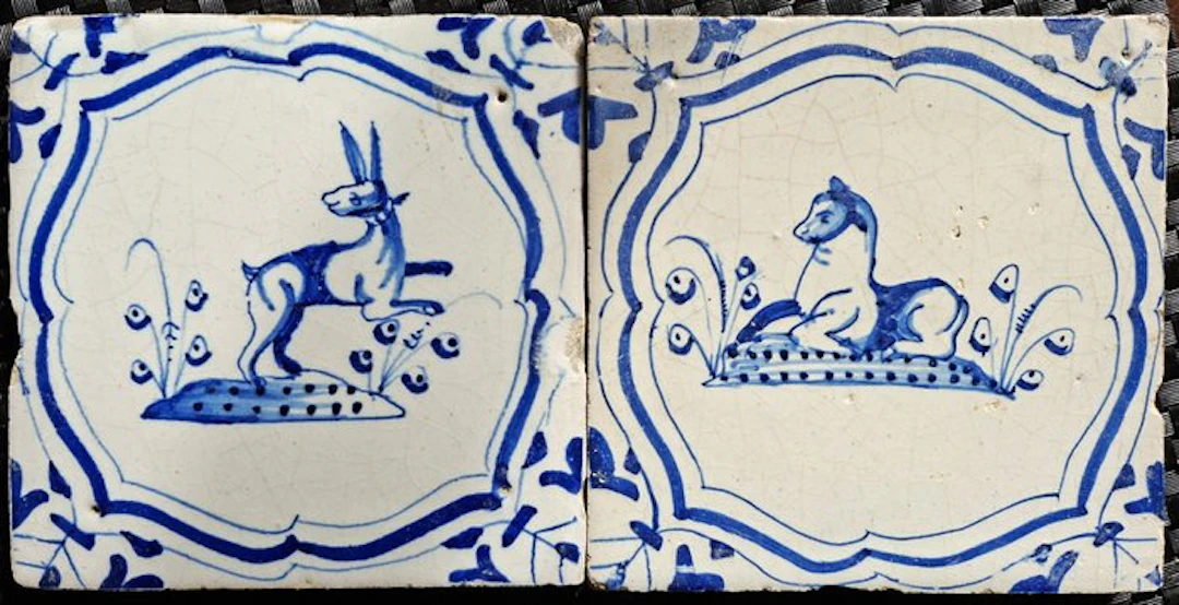 Tile - Two antique Delft blue tiles with a hare and a reclining horse