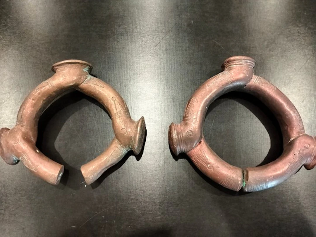 A superb pair of coin bracelets with prongs in bronze