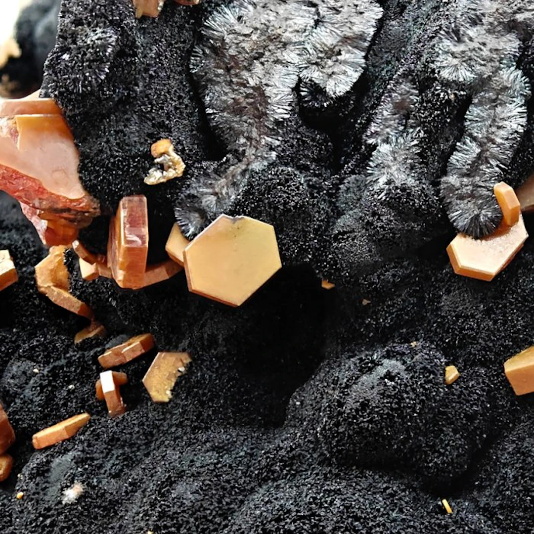 Storm of blood-red vanadinite on velvety goethite