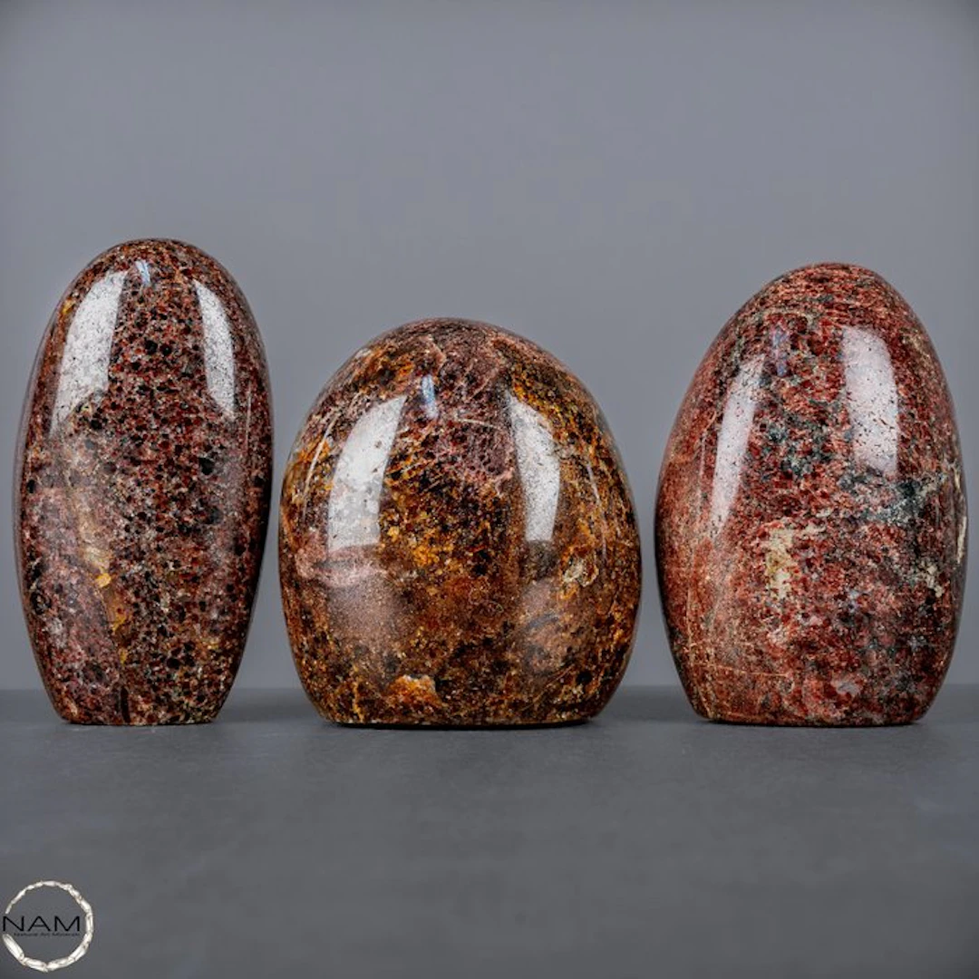 Expressive natural garnet freeforms with a deep red...