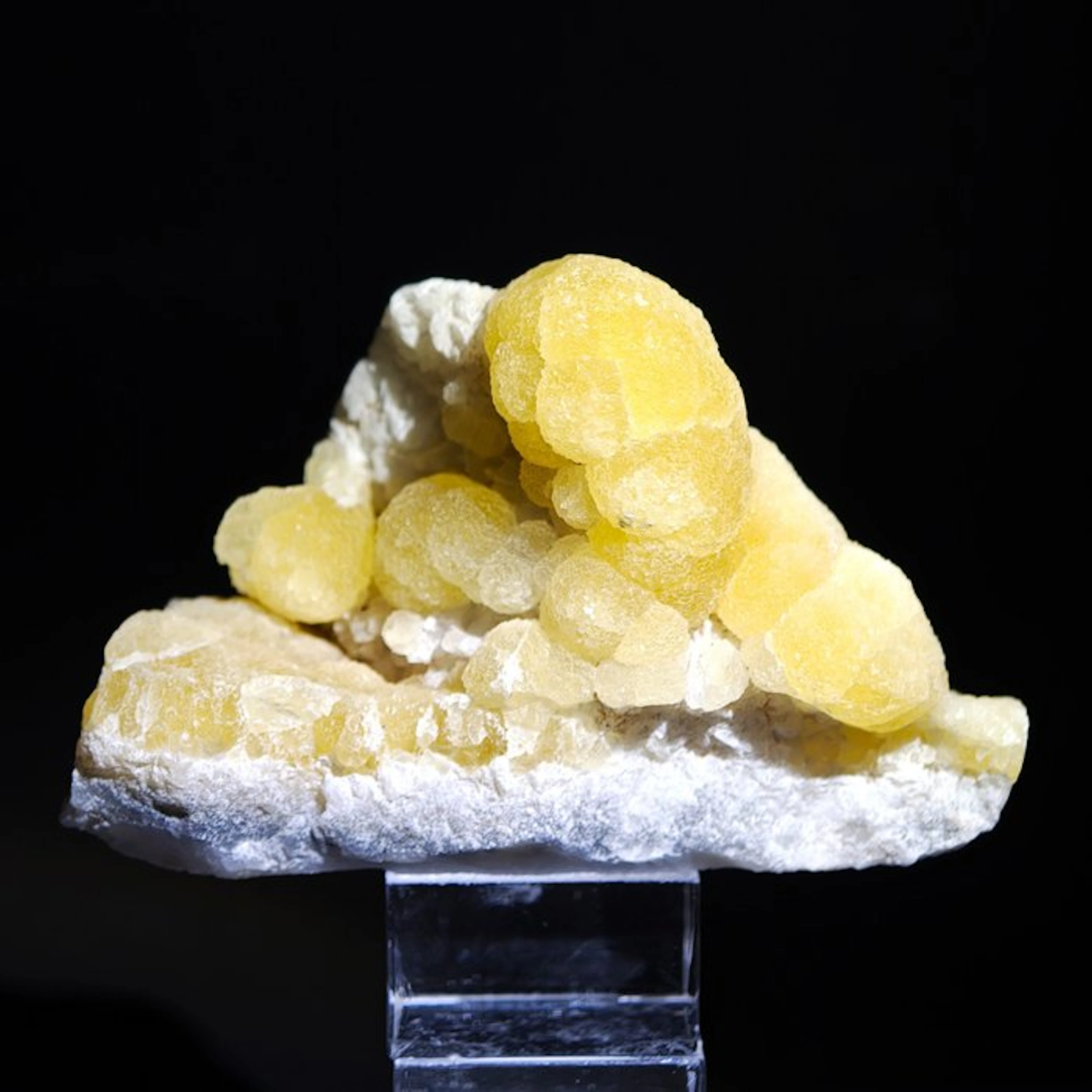 Yellow spherical fluorite on quartz