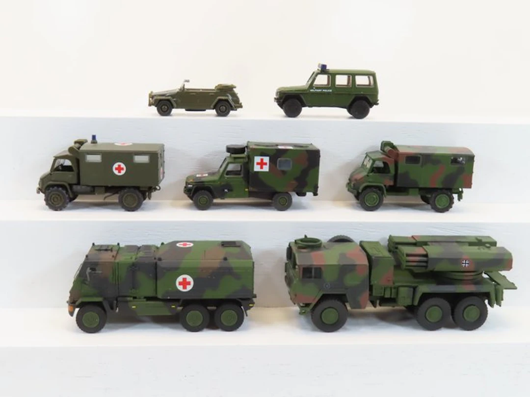 Schuco 1:87 - Model train vehicles (7) - 7 Army vehicles...