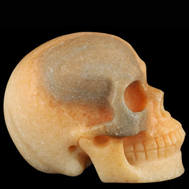 1.34 kg orange calcite skull – Sun Wukong