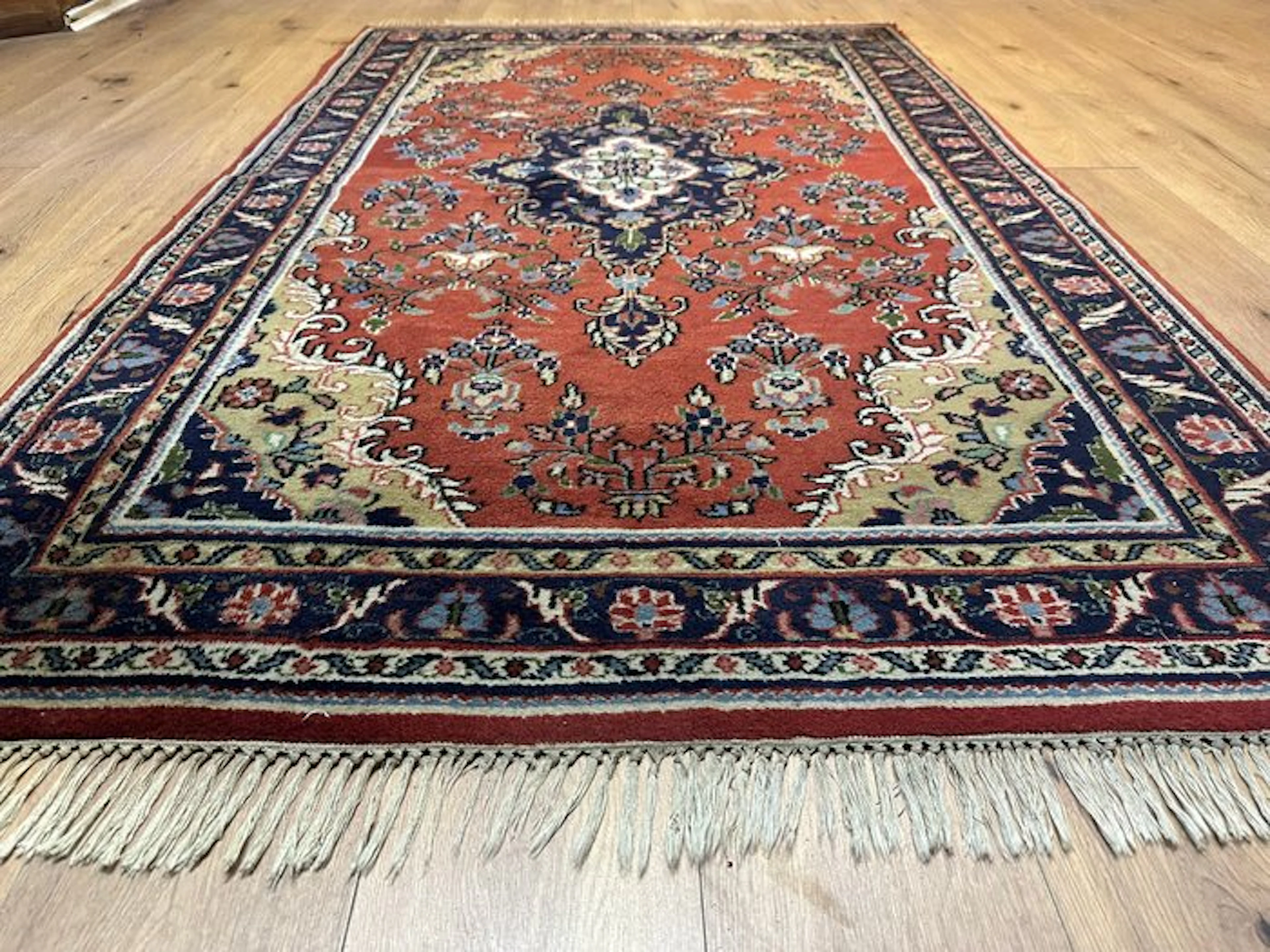 Classic Indian Sarough rug with an elegant medallion pattern and fine details