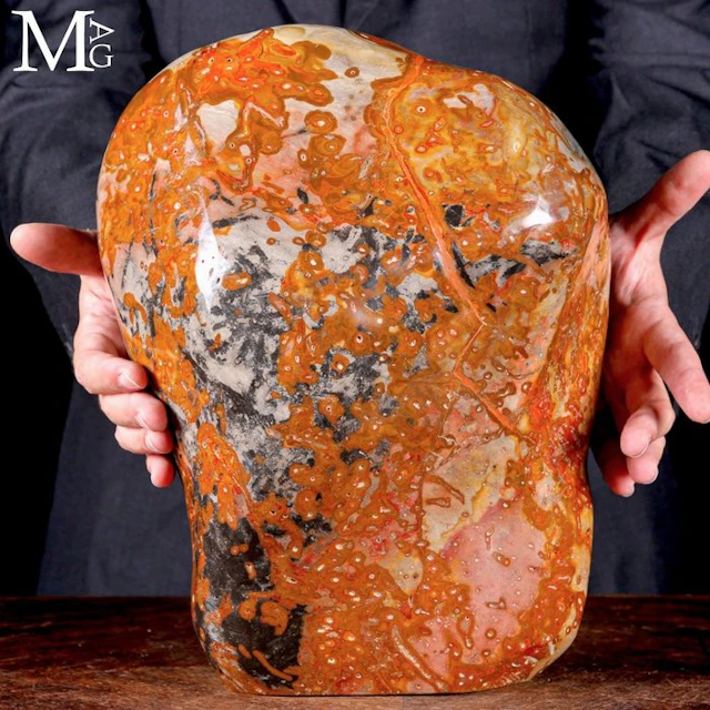 Massive polychrome jasper with fiery orange and earthy orbicular motifs