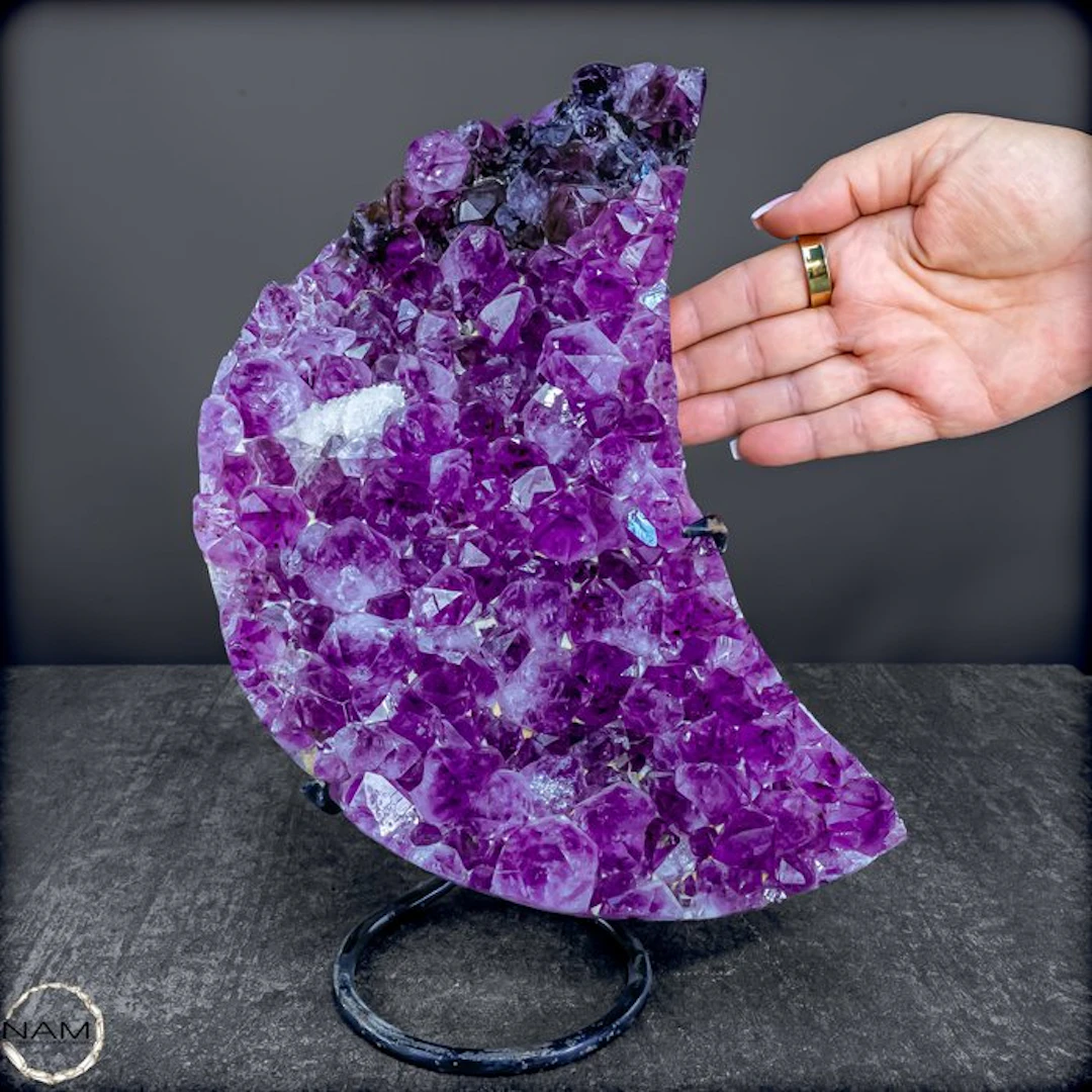 Natural amethyst in crescent moon shape on stand from...