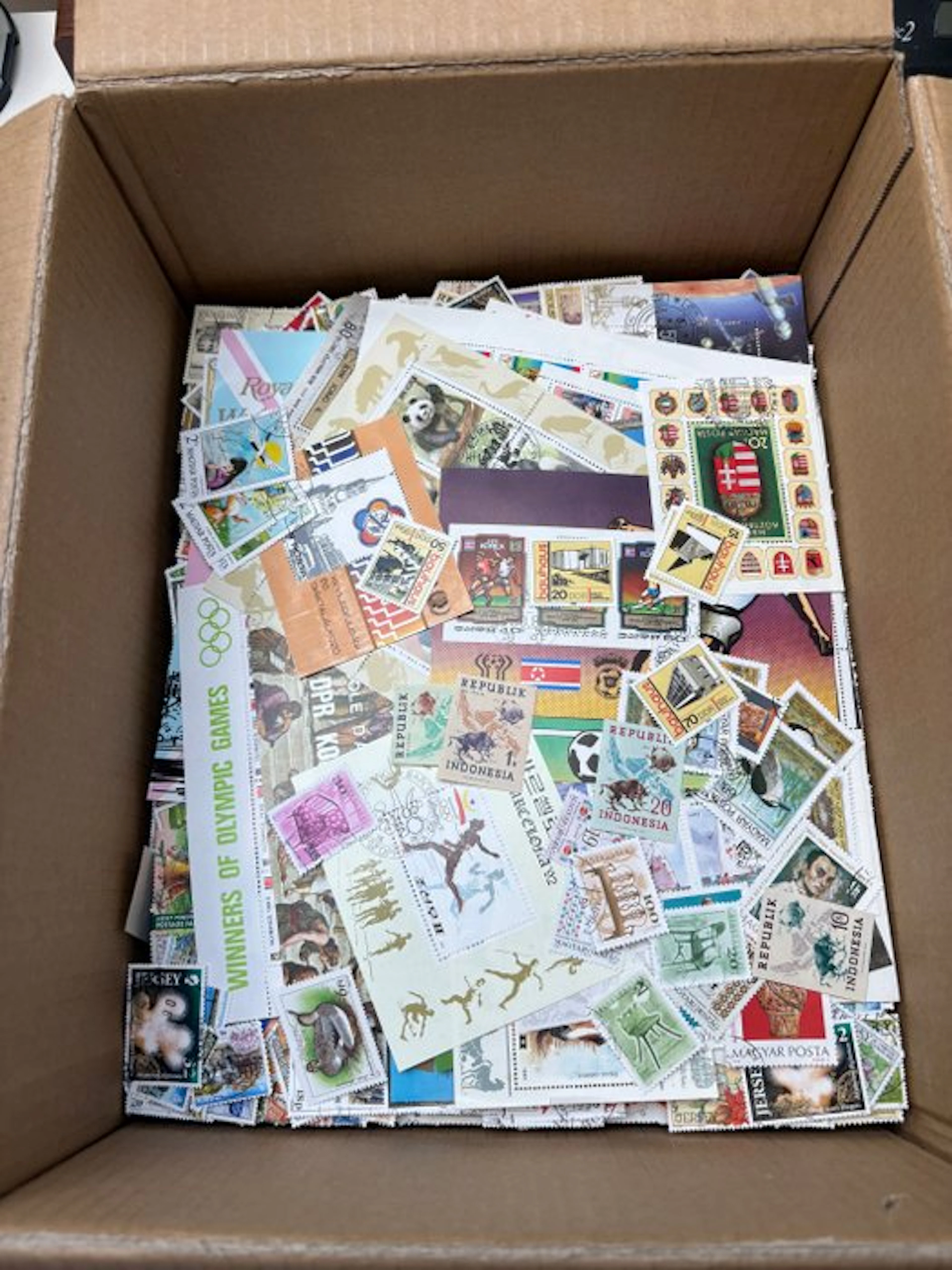 World - Box of unsorted stamps from around the world