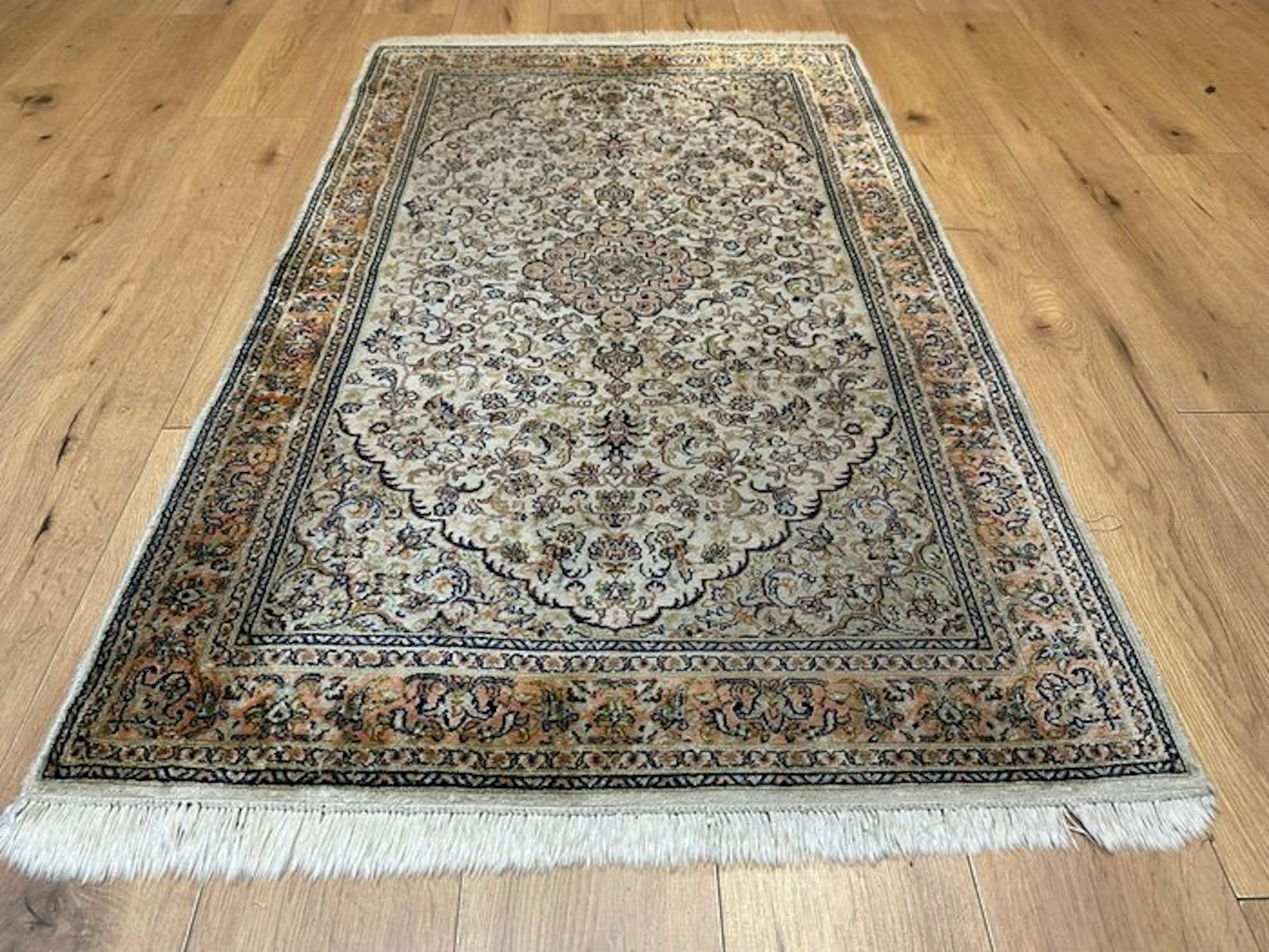 Hand-knotted cashmere-silk rug with a delicate medallion pattern