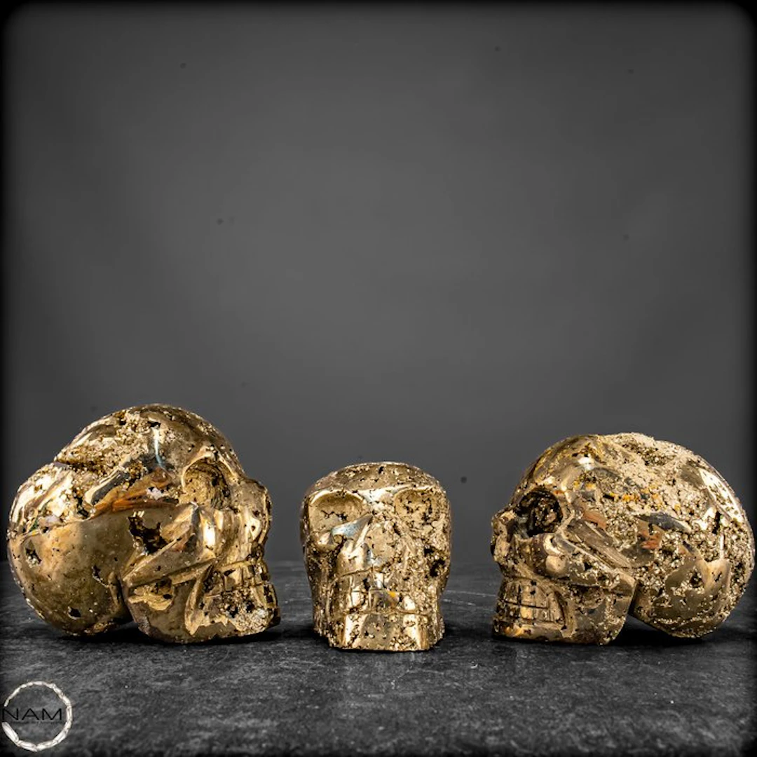 Exceptional pyrite skull set from Peru – three unique...