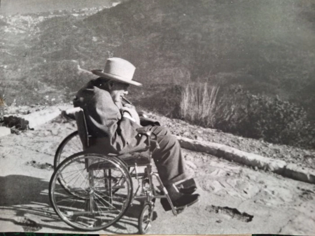Associated Press - Sir Winston Churchill smoking a cigar at Col de la Madone