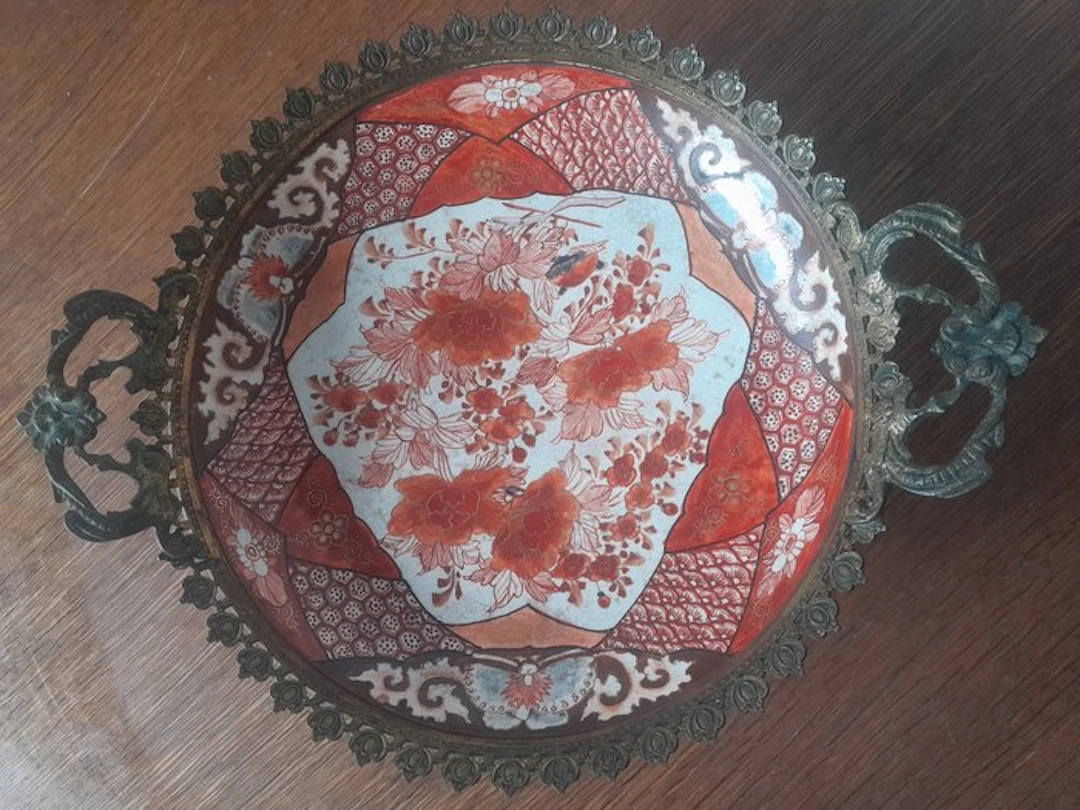 Antique Japanese Kutani porcelain dish in a gilded bronze frame