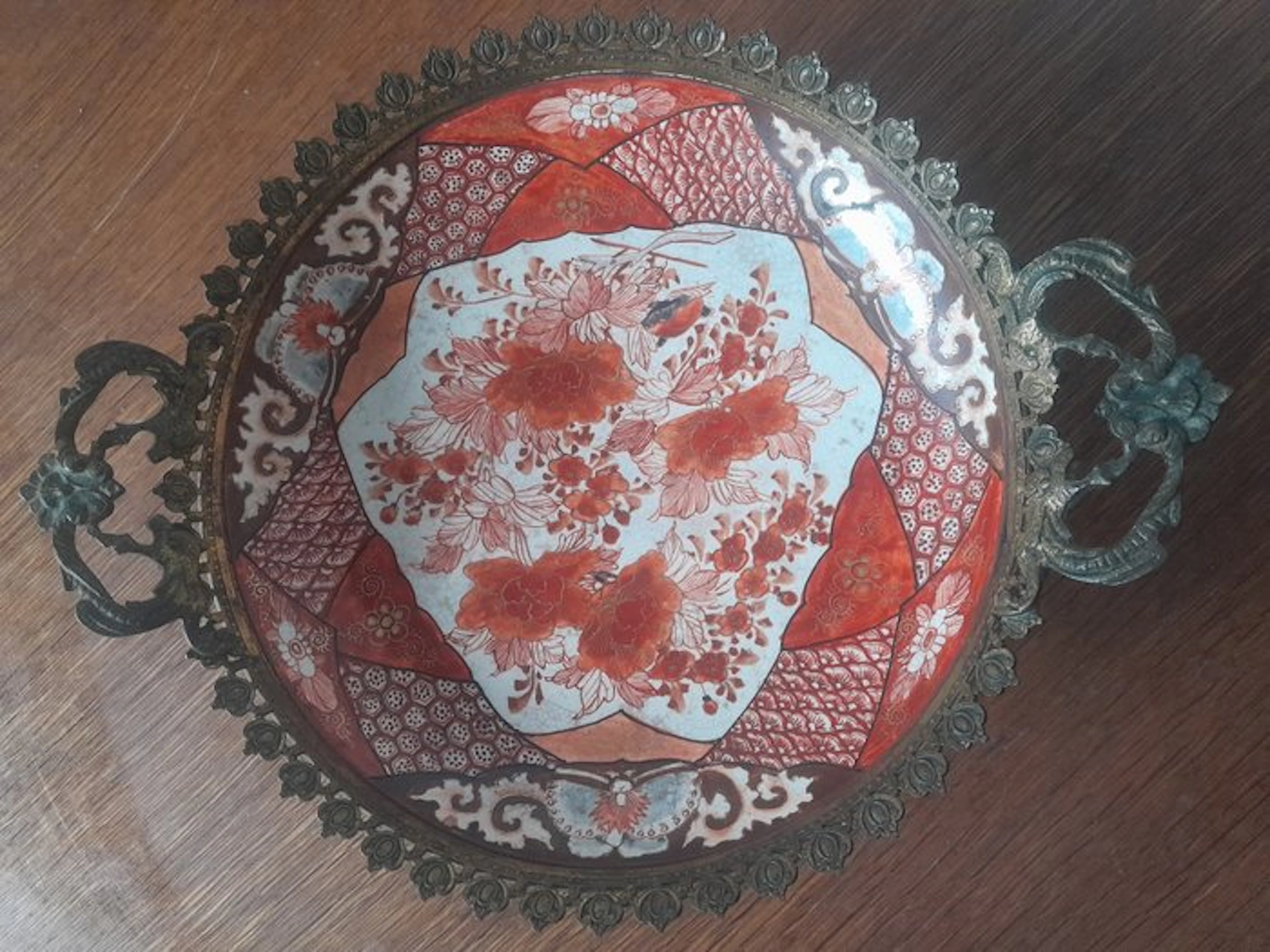 Antique Japanese Kutani porcelain dish in a gilded bronze frame