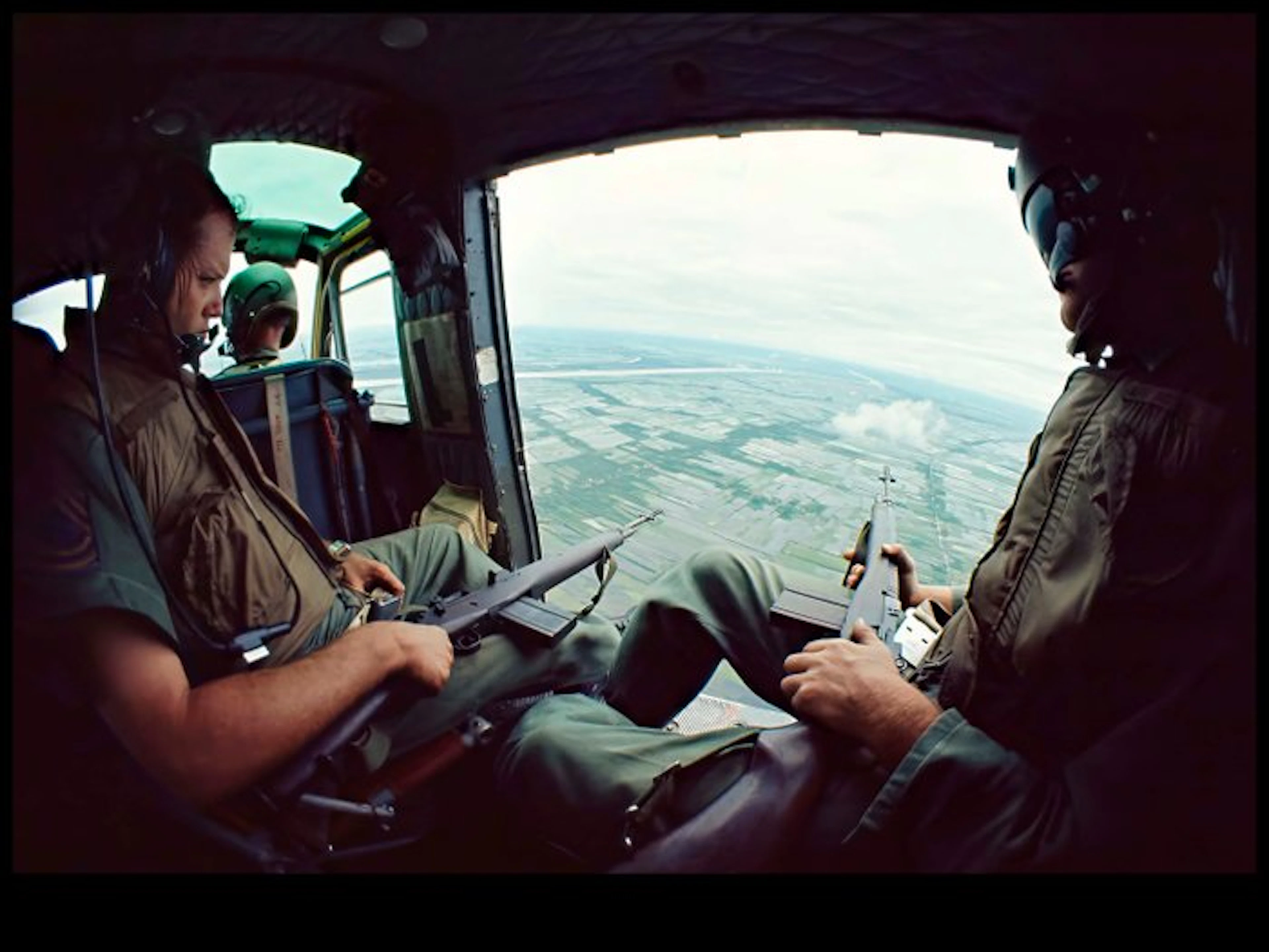 Michael Joseph (1941-) - Door Gunners in Flight