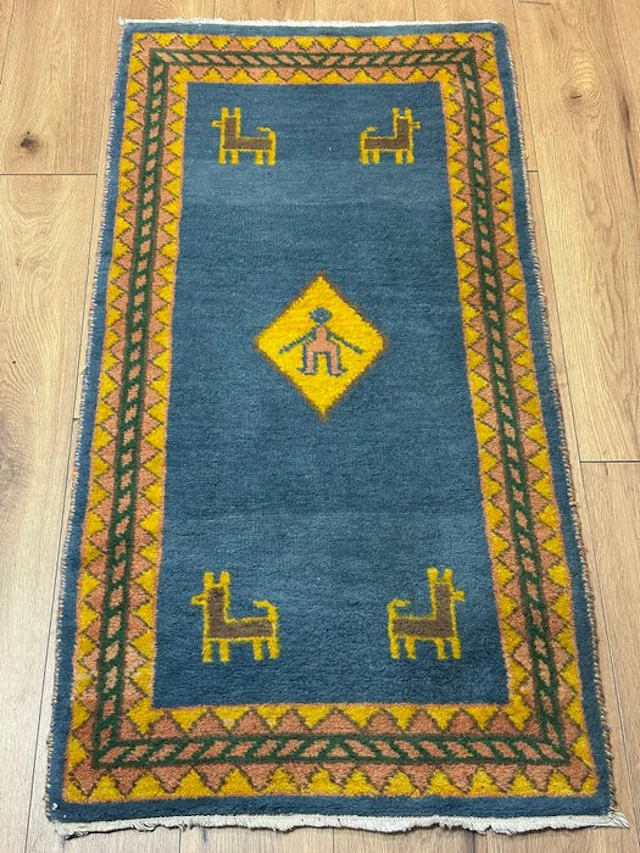 Beautiful Gabbeh rug with figurative motifs and a geometric border