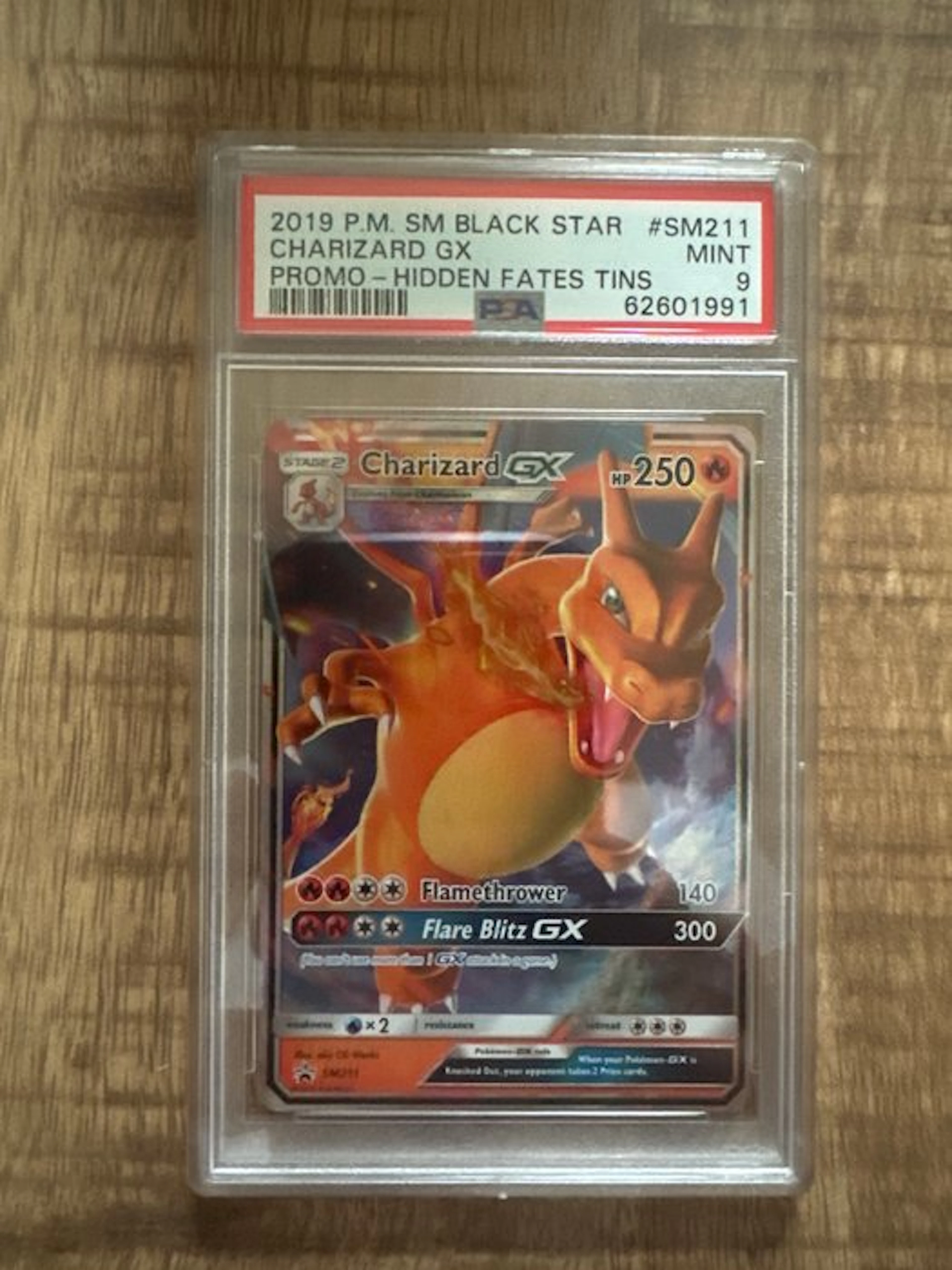 Pokémon - 1 Graded card - Charizard #SM211 Promo card