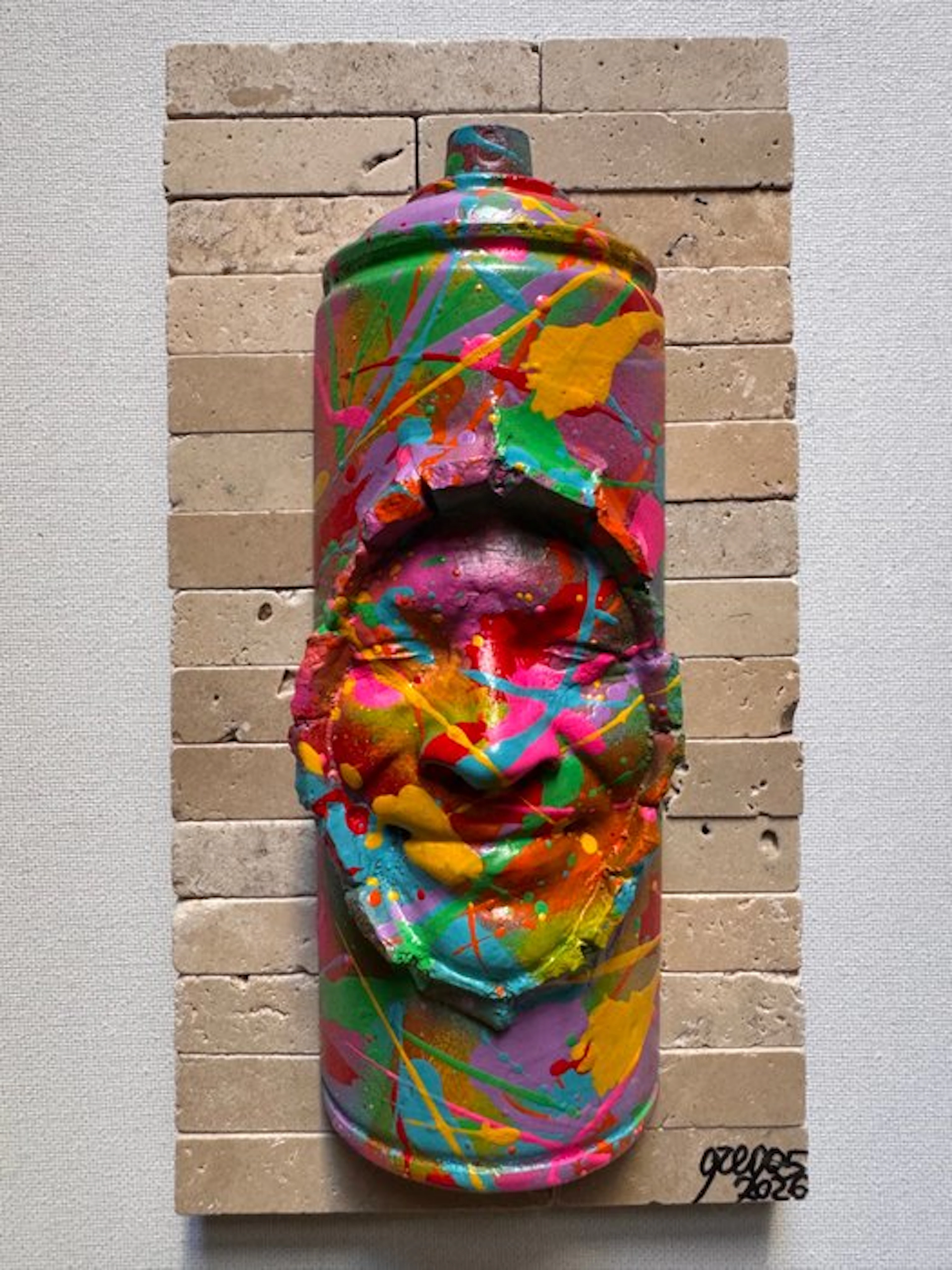 gregos - Colored smiling spray can on bricks