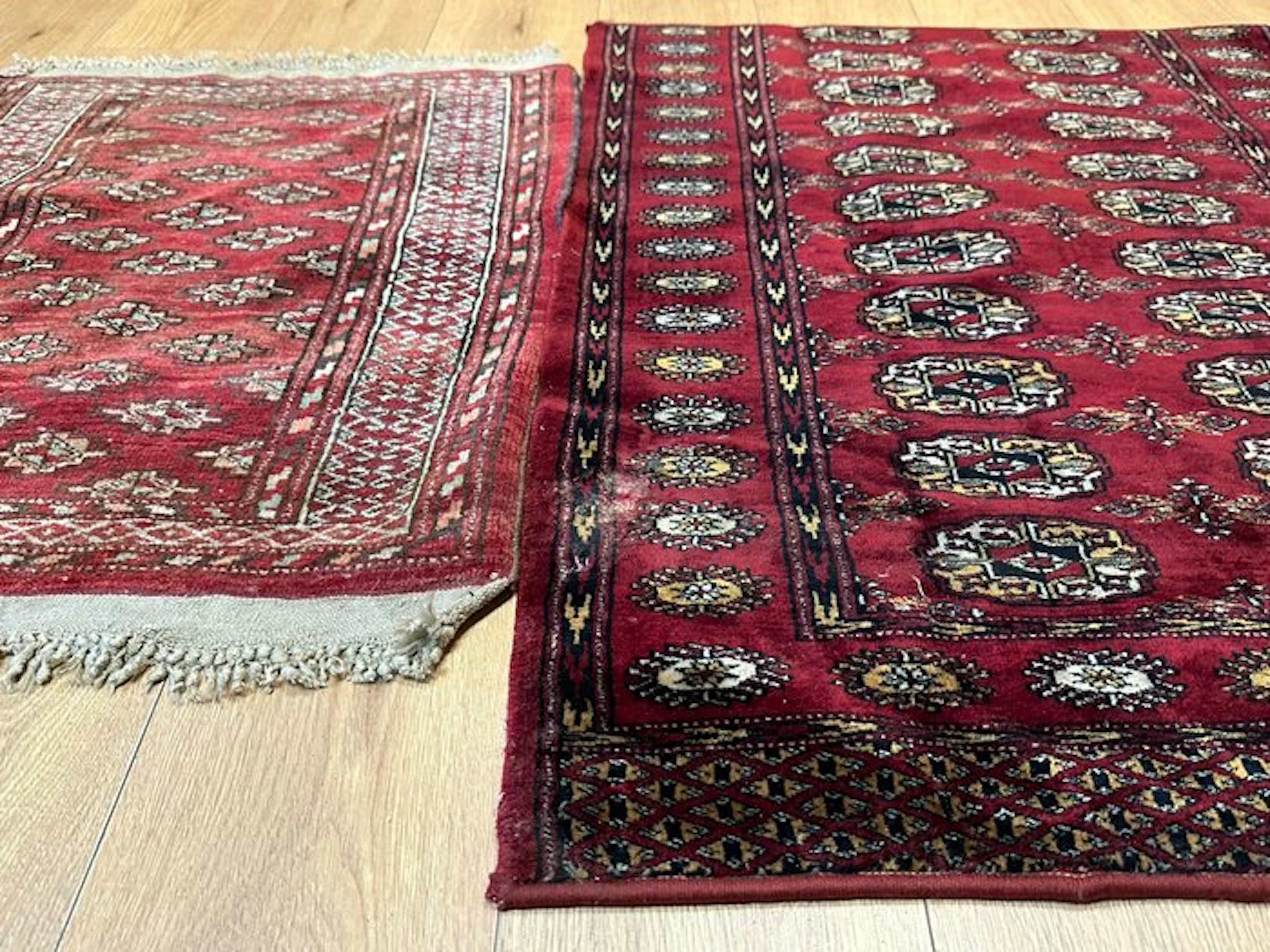 Hand-knotted Pakistani Bukhara rug with a traditional gul pattern