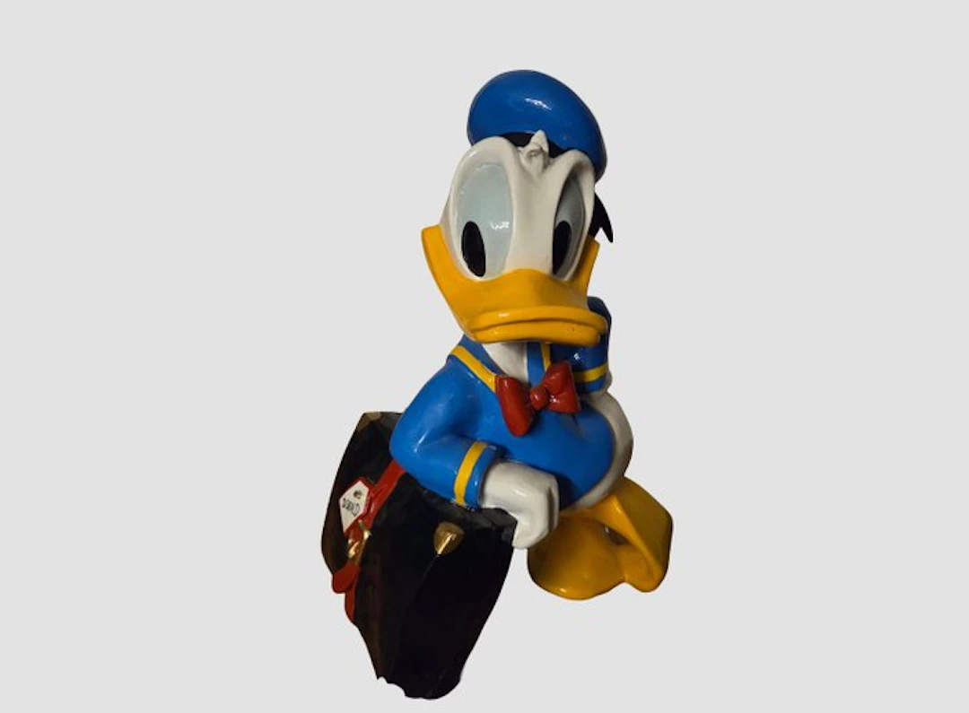 Walt Disney - Donald Duck Figure leaning on his suitcase...