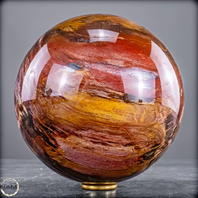 Natural petrified wood as a sphere – intense grain with...