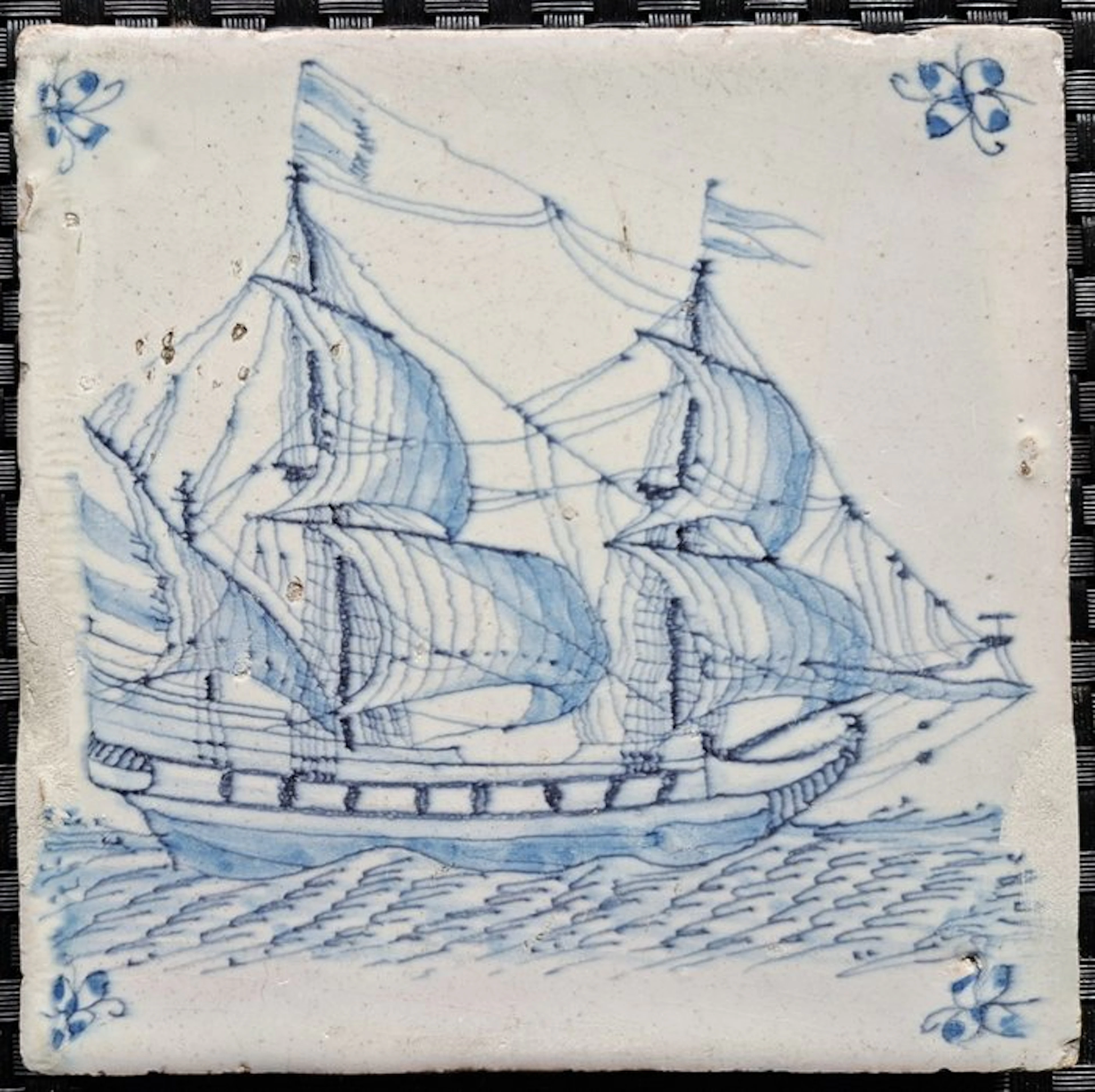 Tile - Antique Delft blue tile with a three-masted ship. - 1600-1650