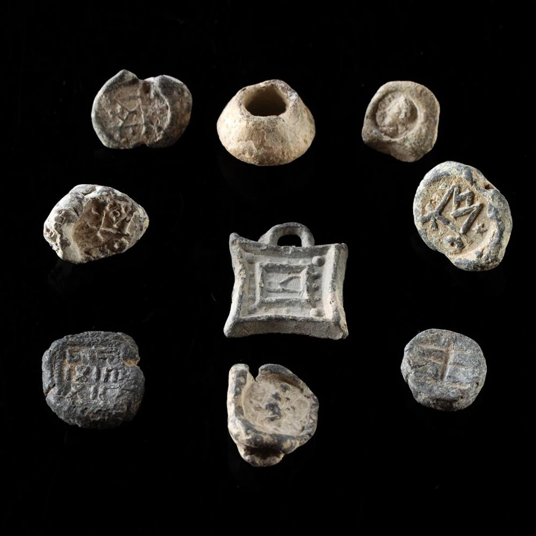Nine Near Eastern Lead & Copper Seals, Beads & Weights - Roman to Islamic