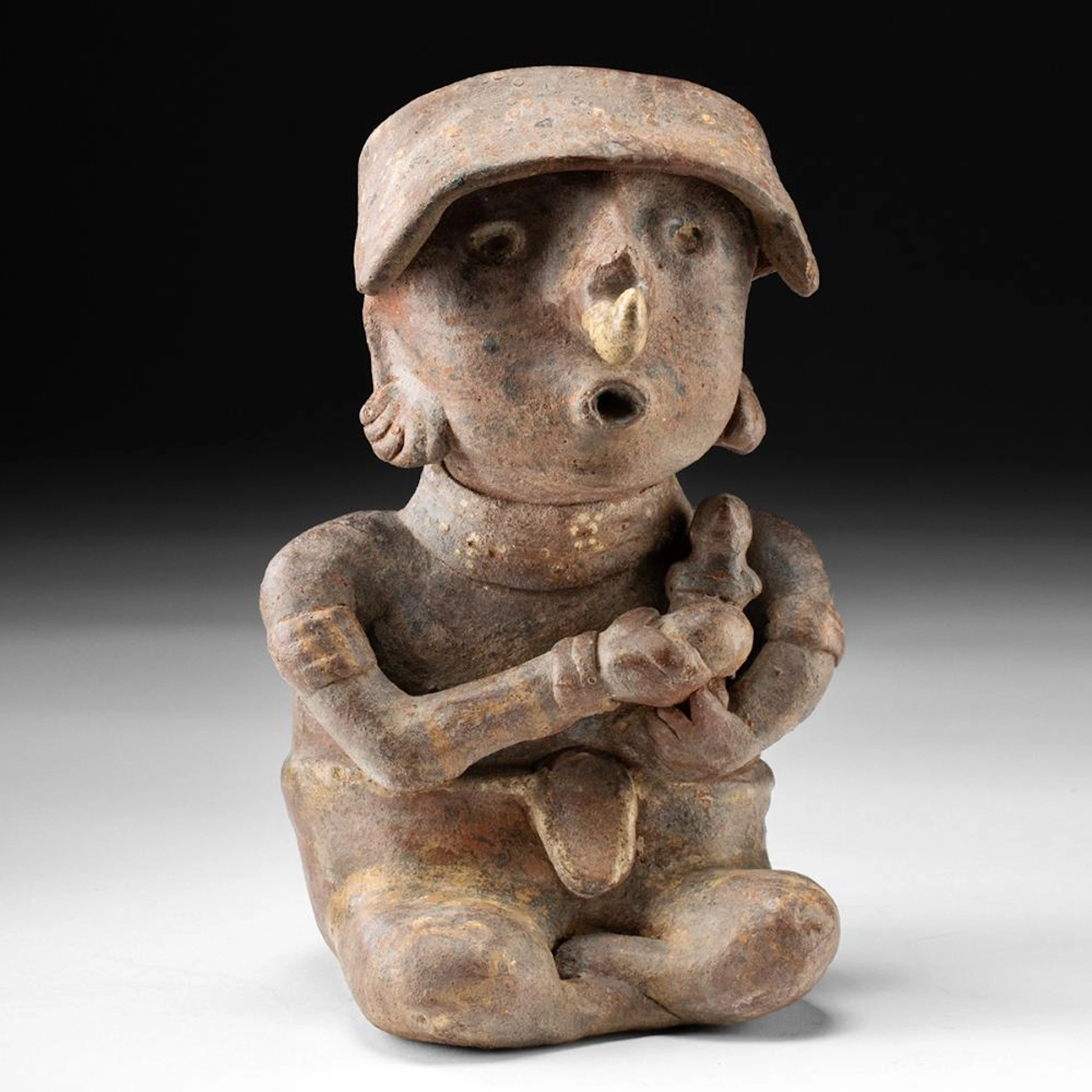 Nayarit Ixtlan del Rio Style Seated Musician Playing a Rasp