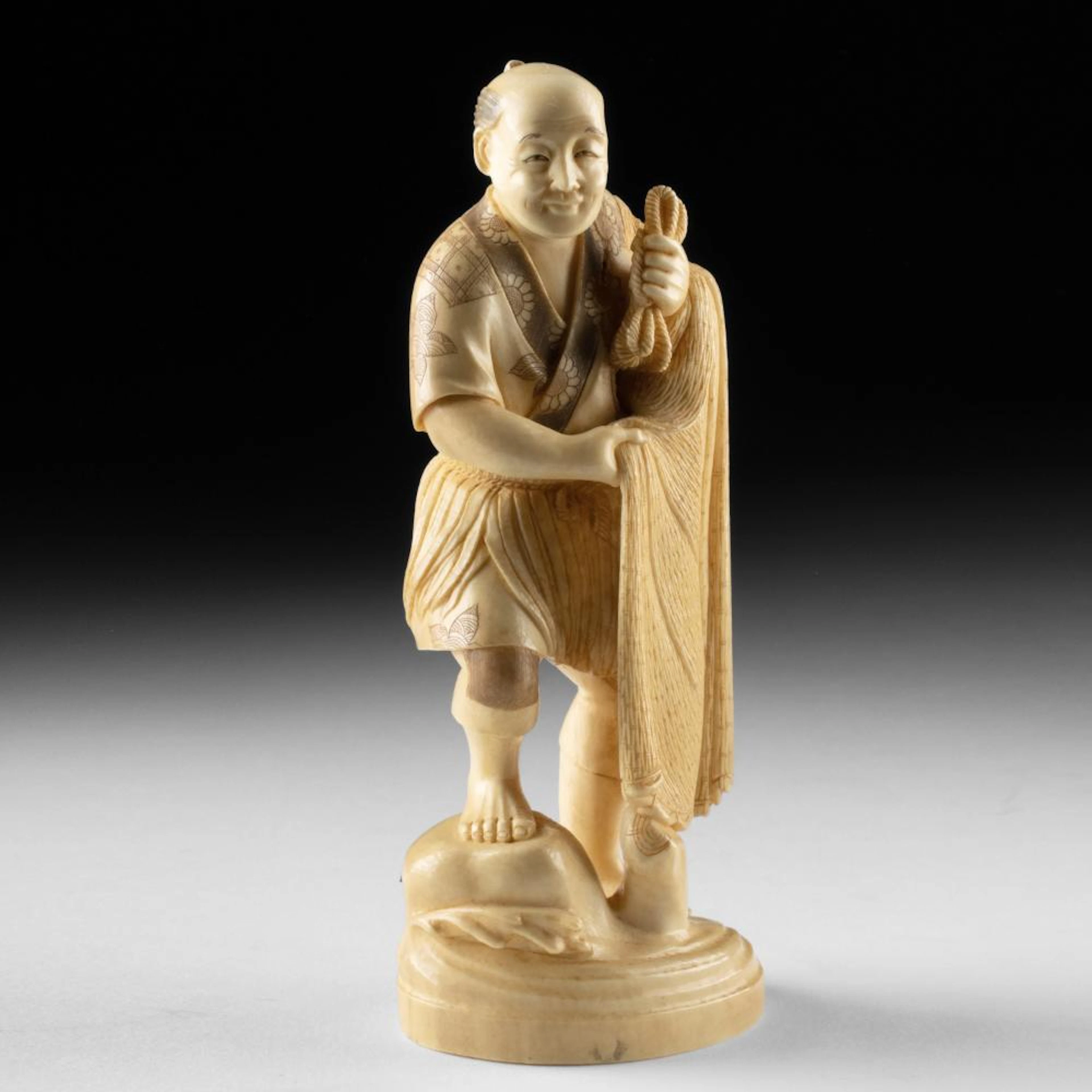 Japanese Meiji Carved Ivory Okimono of a Fisherman with Net