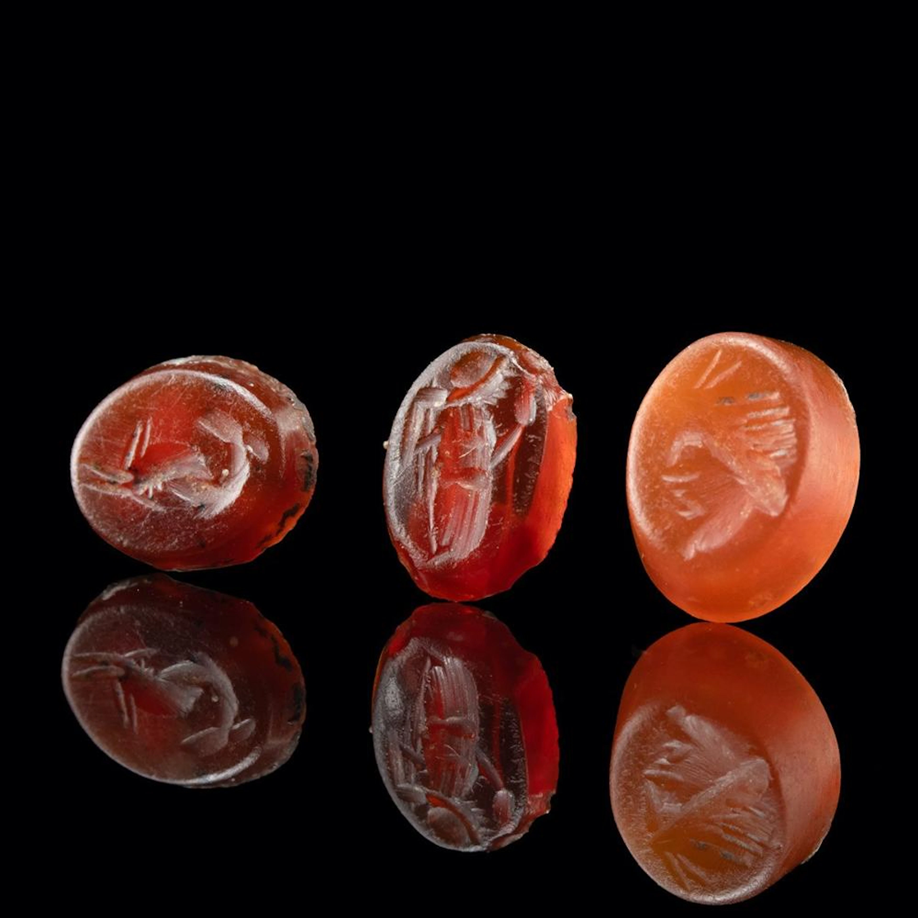 3 Roman Intaglios - Garnet Dolphin, Carnelian Pan & Glass Nike