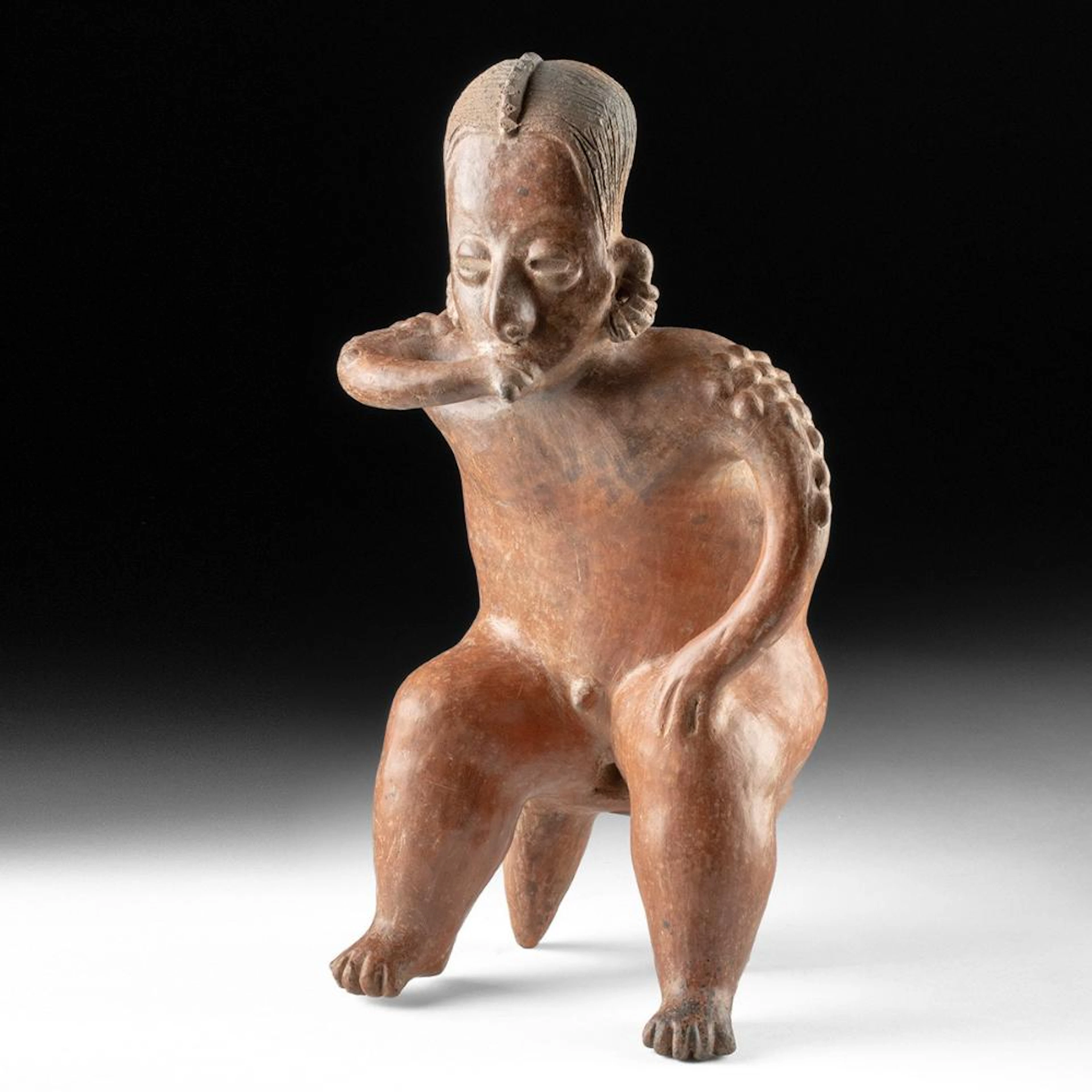 San Sebastian Red Seated Male Smoker Figure on Stool
