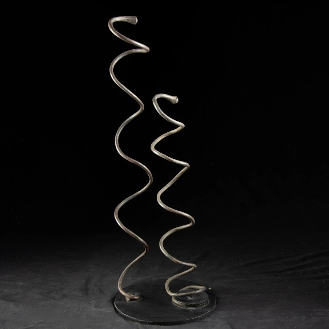 Two Ngelima Copper Currency Spirals on Custom Stand