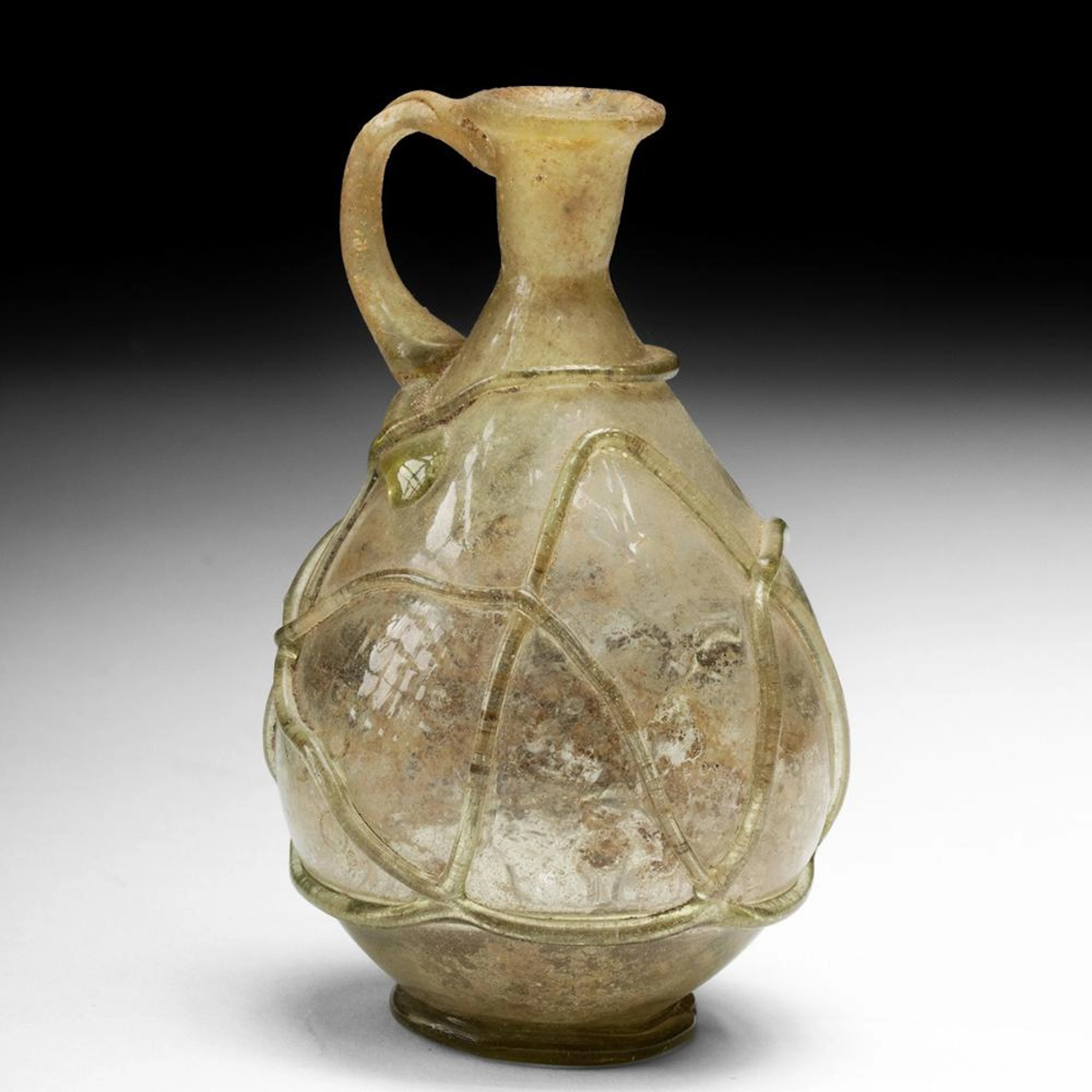 Early Islamic Glass Pitcher with Trailed Body & Handle