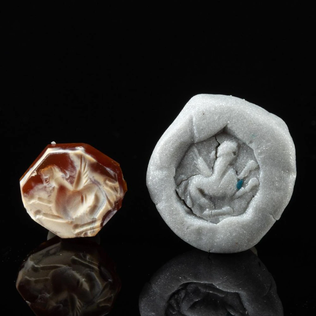 Achaemenid Miniature Octagonal Agate Intaglio of a Seated Winged Sphinx