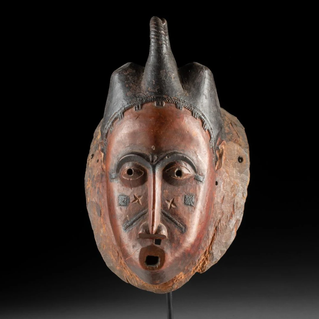 Baule Mblo Portrait Mask, Red Face with Black Crested Coiffure, Côte d’Ivoire