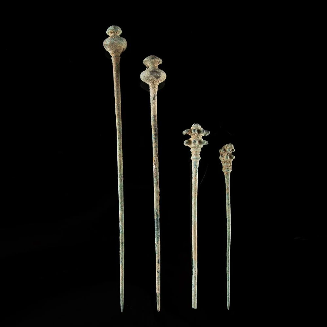 Four Luristan Bronze Garment Pins - Floral & Domed Finials