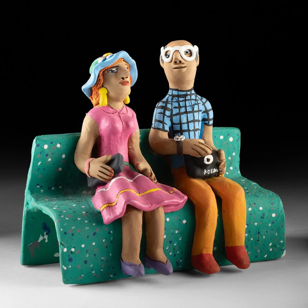 Mexican Folk Art Sculpture of Tourist Couple on Bench, Signed Josefina Aguilar