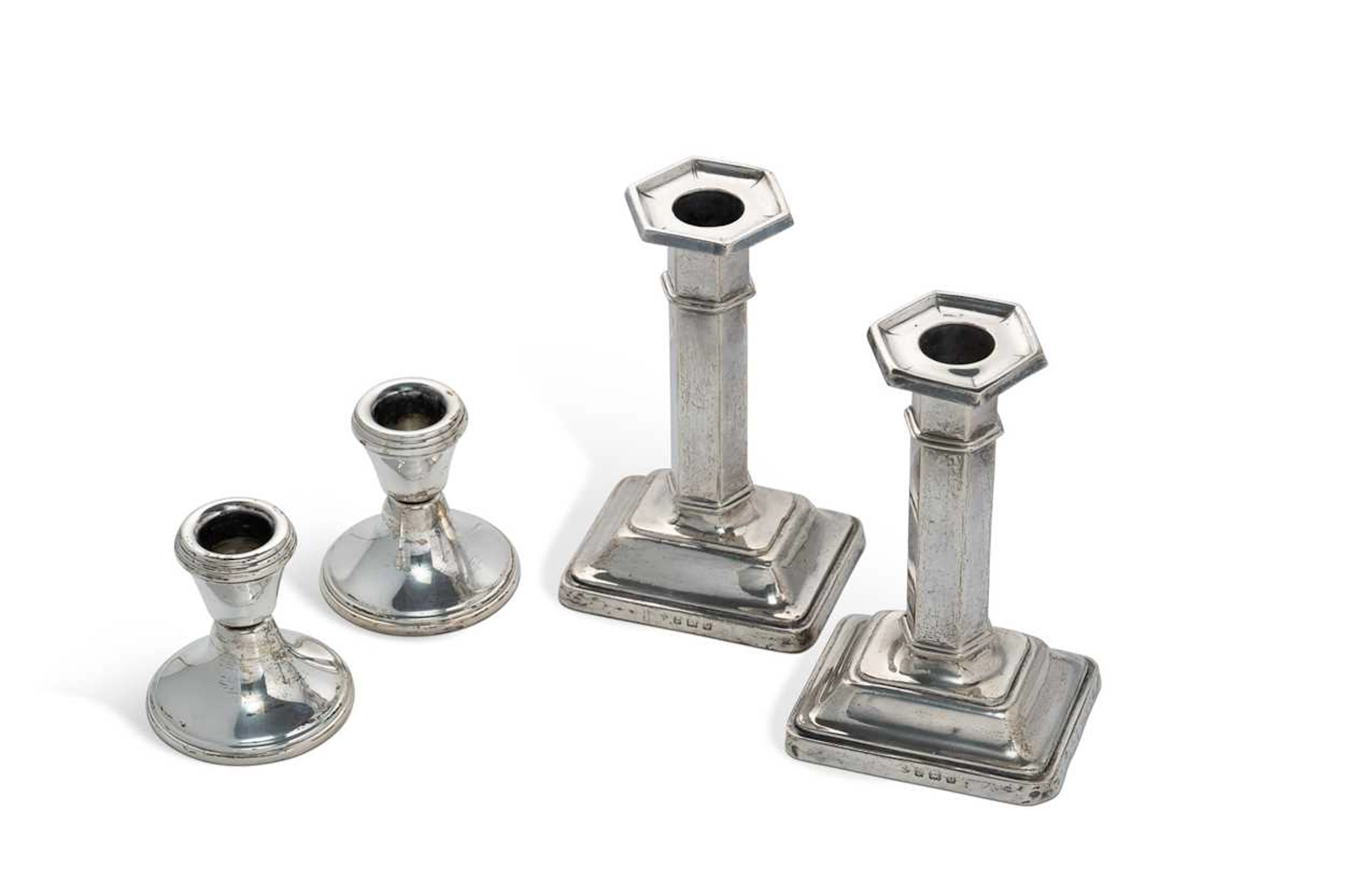 A pair of George V silver column candlesticks