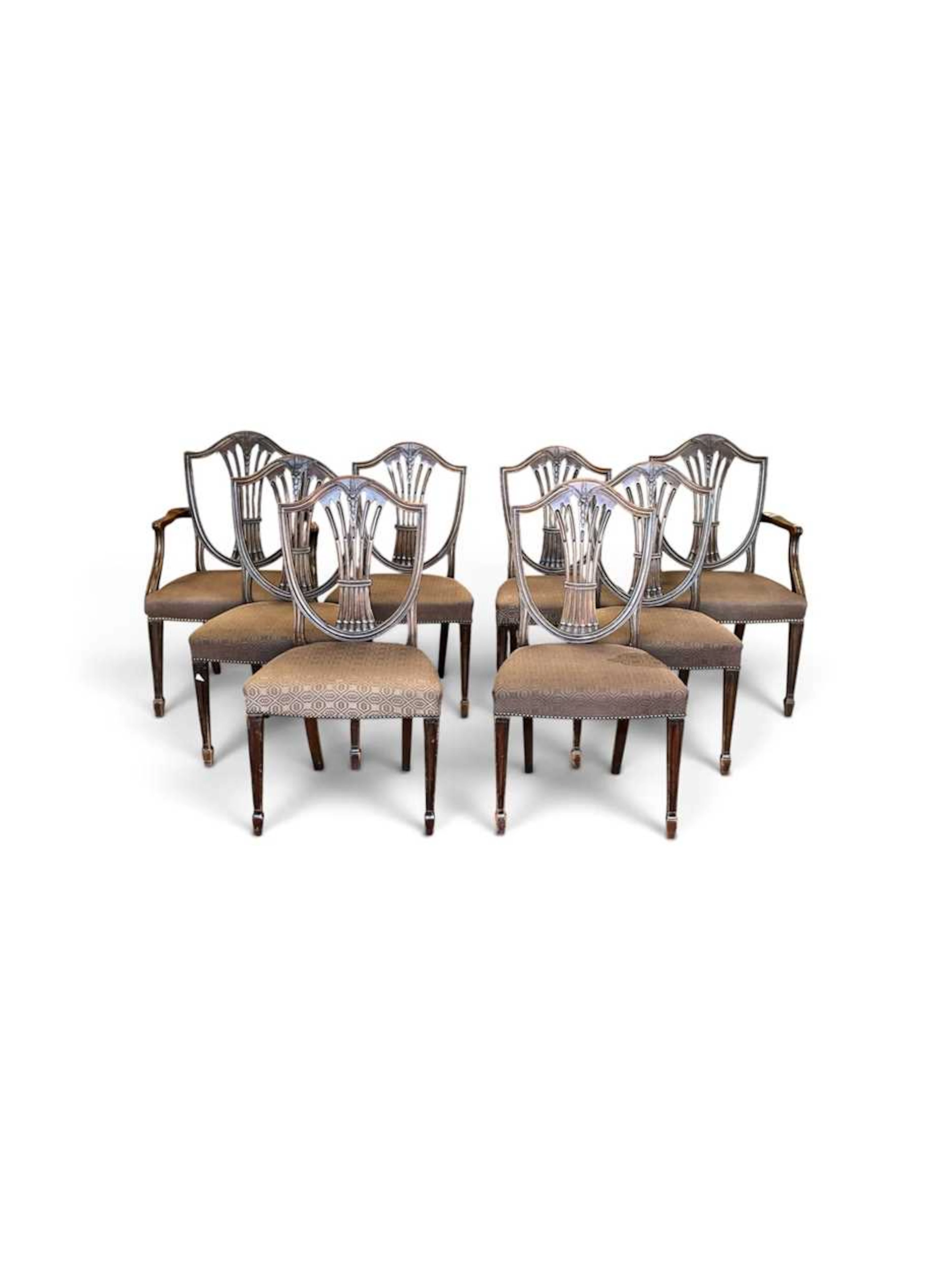 A set of eight George III style mahogany dining chairs